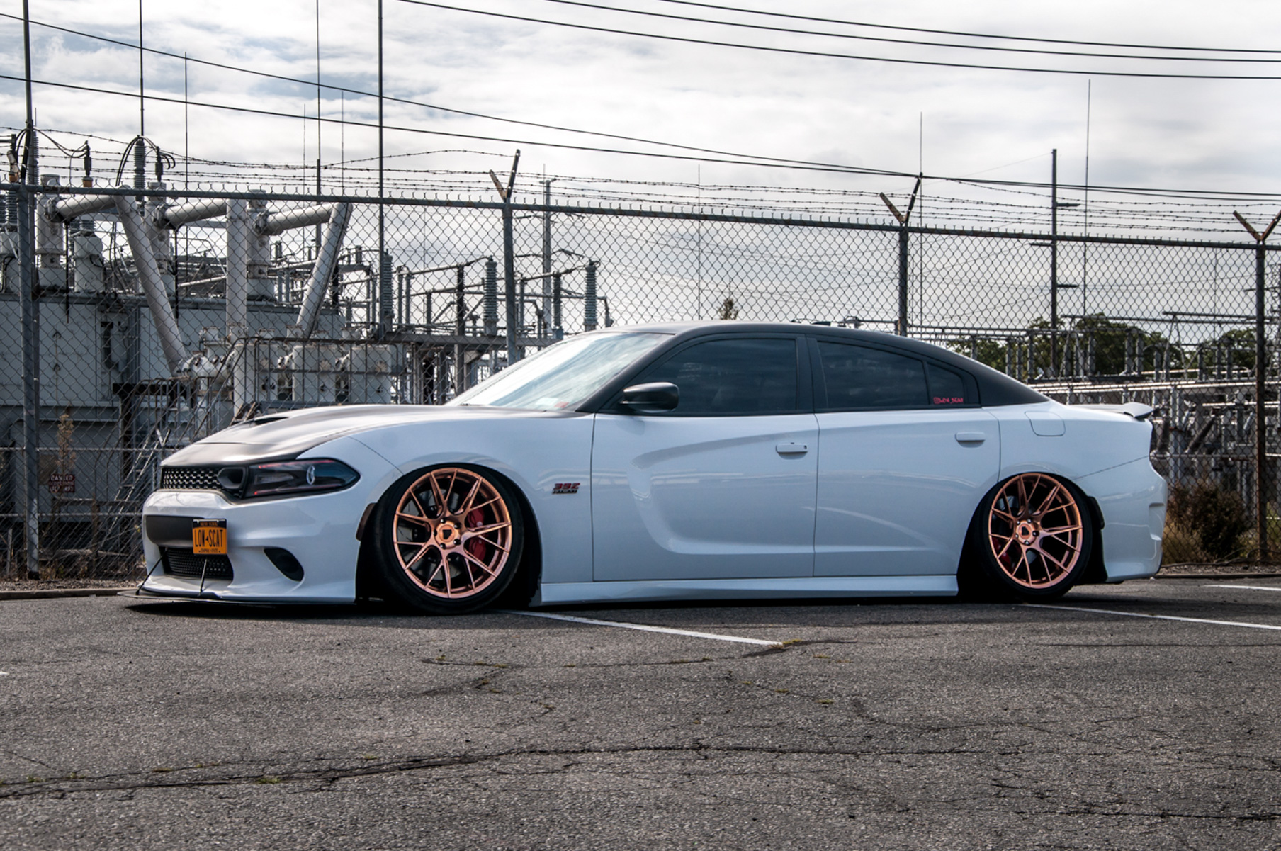 A 2018 Dodge Charger on 20 Inch Blaque Diamond BD-F18 Custom Polished Rose Gold Wheels