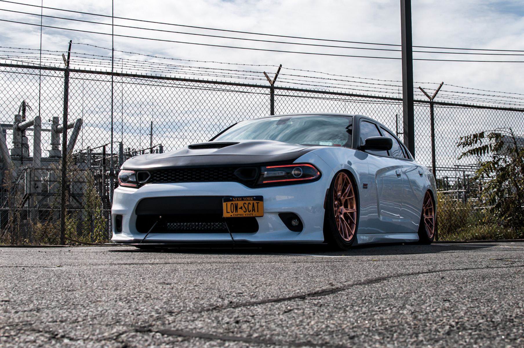 A 2018 Dodge Charger on 20 Inch Blaque Diamond BD-F18 Custom Polished Rose Gold Wheels