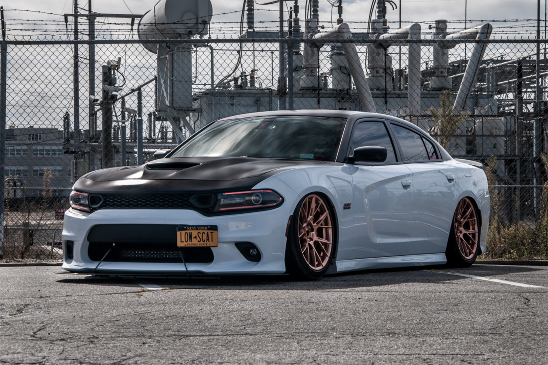 A 2018 Dodge Charger on 20 Inch Blaque Diamond BD-F18 Custom Polished Rose Gold Wheels