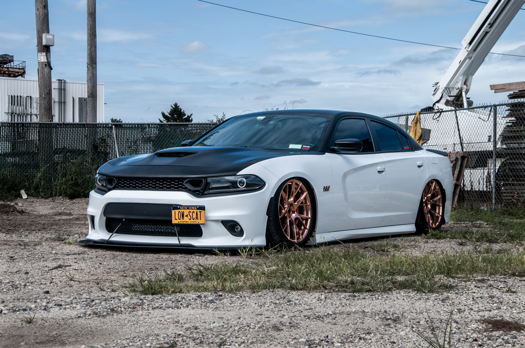 A 2018 Dodge Charger on 20 Inch Blaque Diamond BD-F18 Custom Polished Rose Gold Wheels