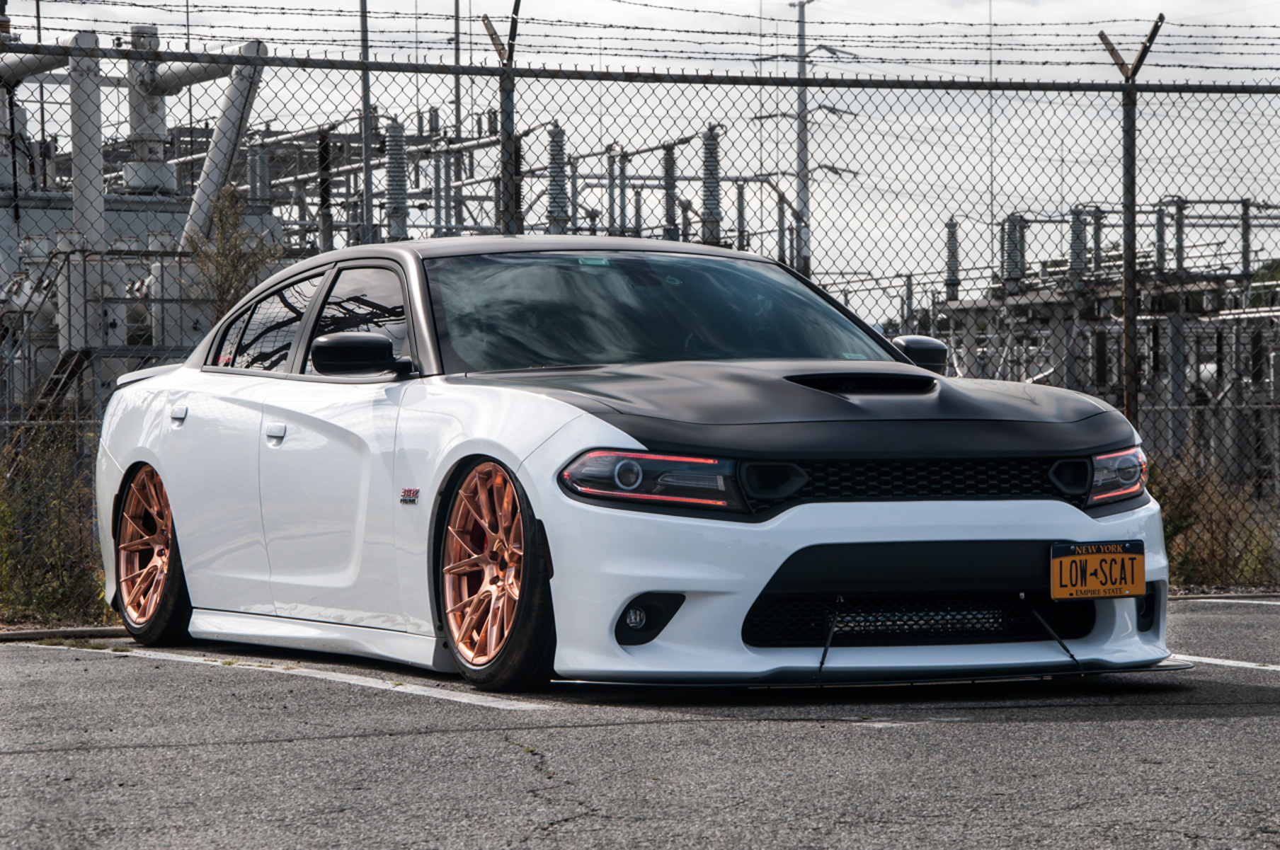 A 2018 Dodge Charger on 20 Inch Blaque Diamond BD-F18 Custom Polished Rose Gold Wheels