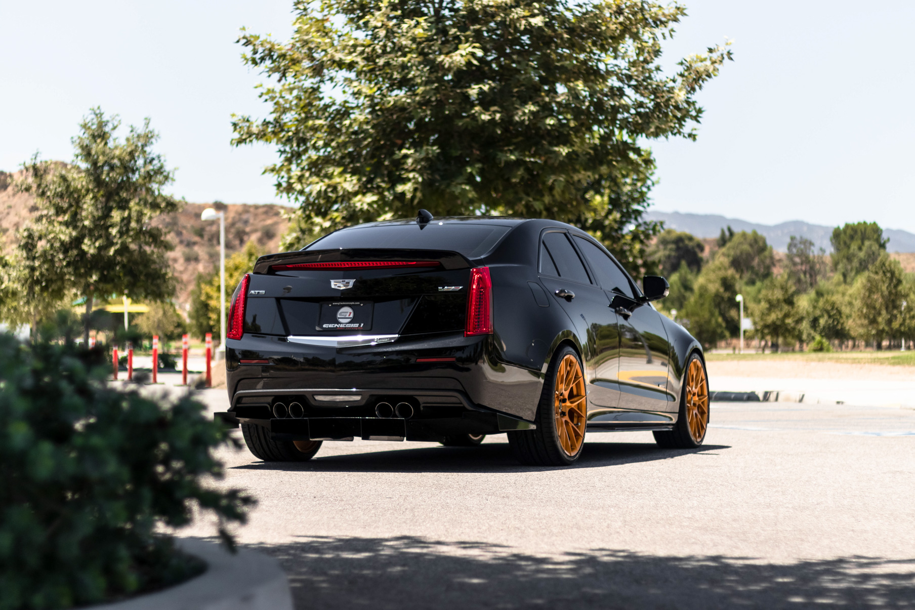 A 2017 Cadillac ATSV on 20 Inch Blaque Diamond BD-F18 Gold Wheels