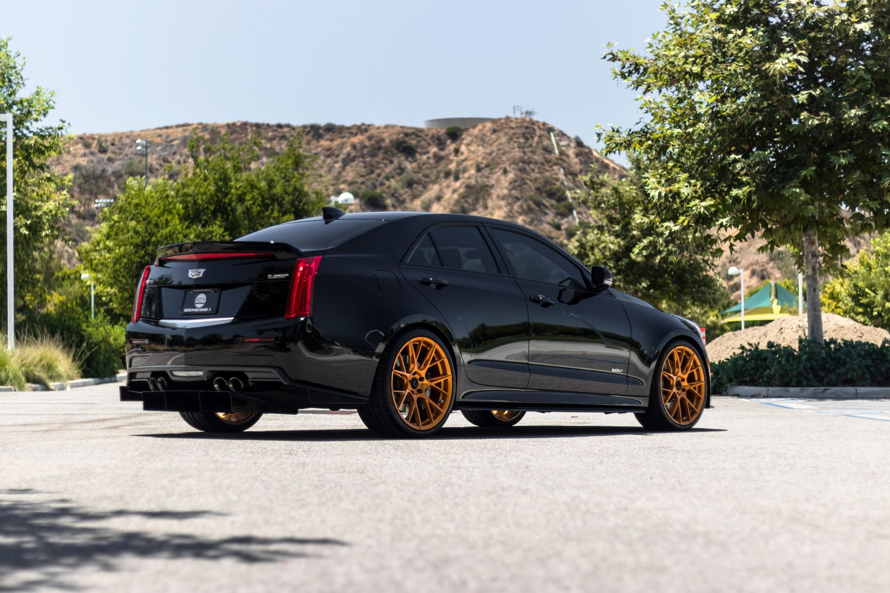 A 2017 Cadillac ATSV on 20 Inch Blaque Diamond BD-F18 Gold Wheels