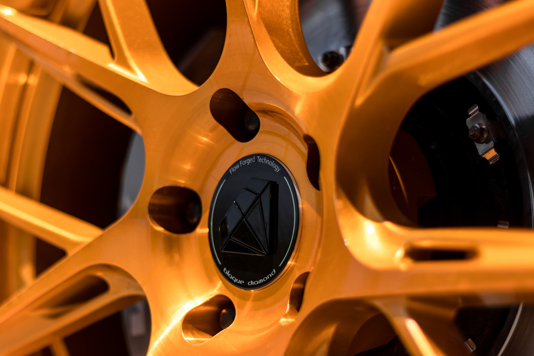 A 2017 Cadillac ATSV on 20 Inch Blaque Diamond BD-F18 Gold Wheels