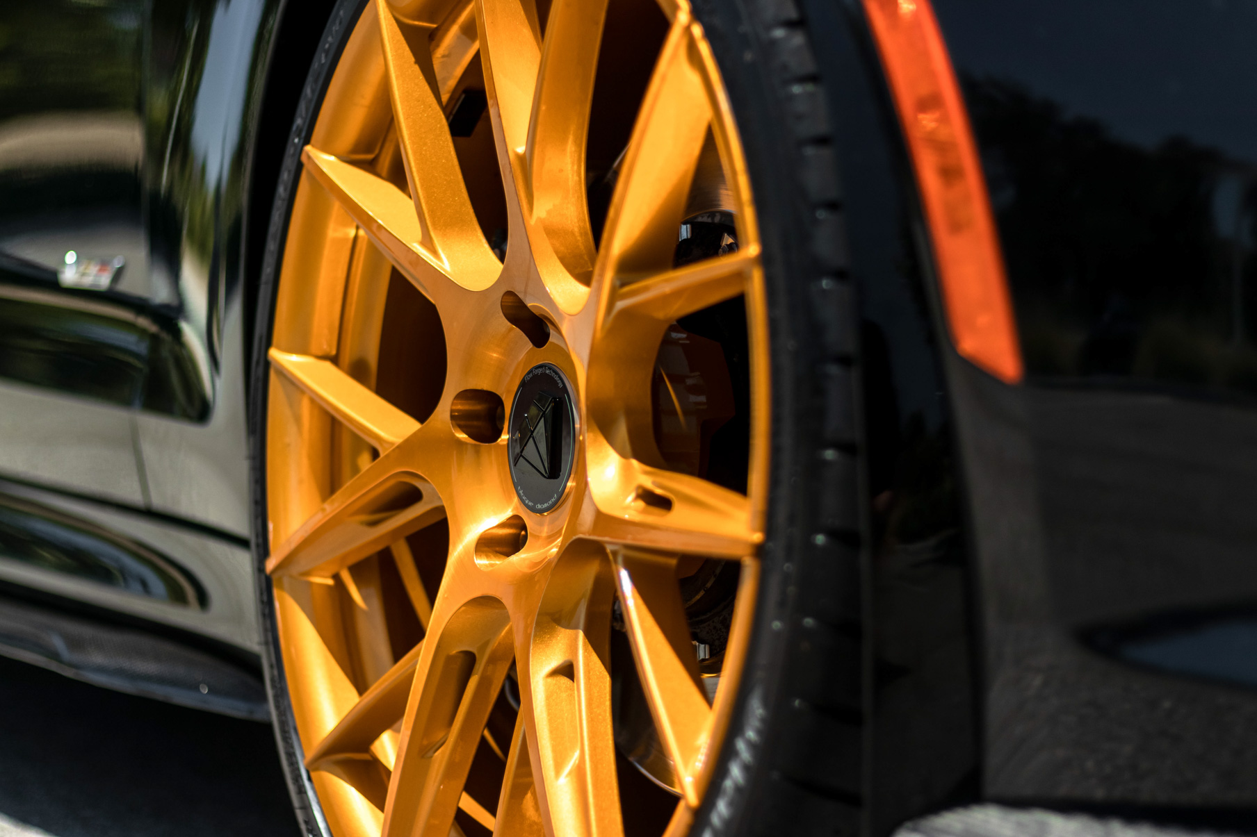 A 2017 Cadillac ATSV on 20 Inch Blaque Diamond BD-F18 Gold Wheels