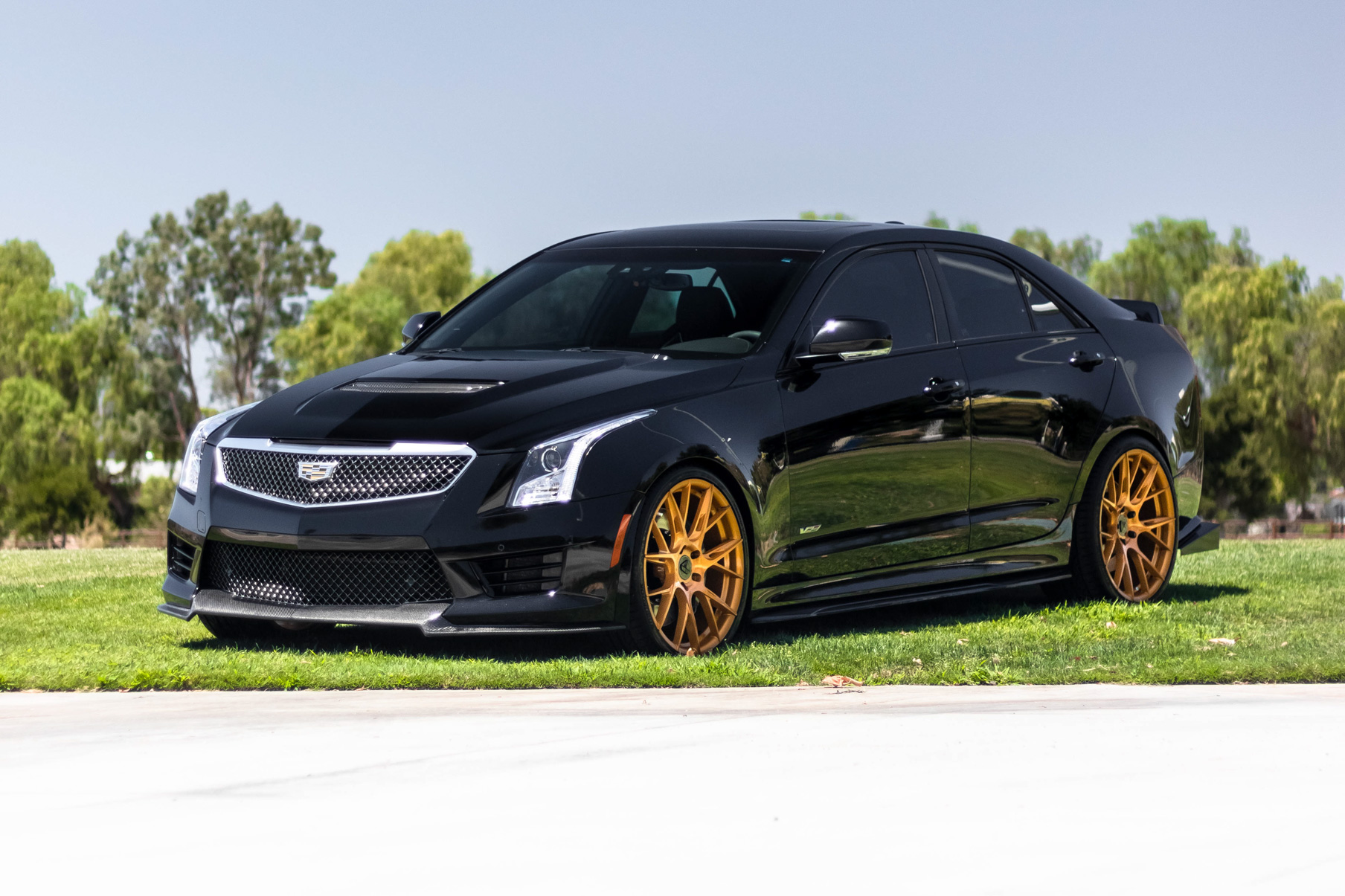 A 2017 Cadillac ATSV on 20 Inch Blaque Diamond BD-F18 Gold Wheels