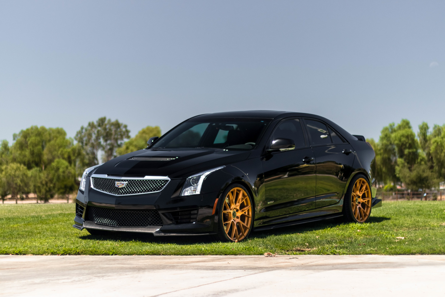 A 2017 Cadillac ATSV on 20 Inch Blaque Diamond BD-F18 Gold Wheels
