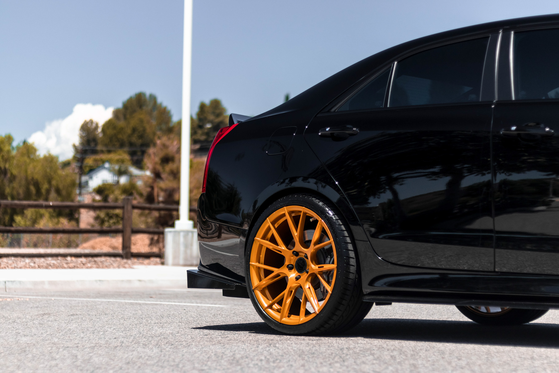 A 2017 Cadillac ATSV on 20 Inch Blaque Diamond BD-F18 Gold Wheels