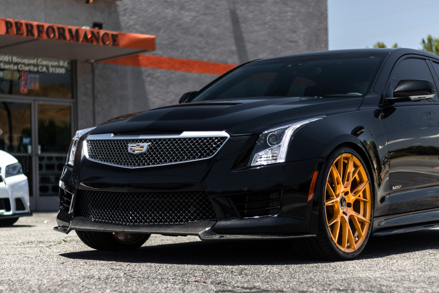 A 2017 Cadillac ATSV on 20 Inch Blaque Diamond BD-F18 Gold Wheels