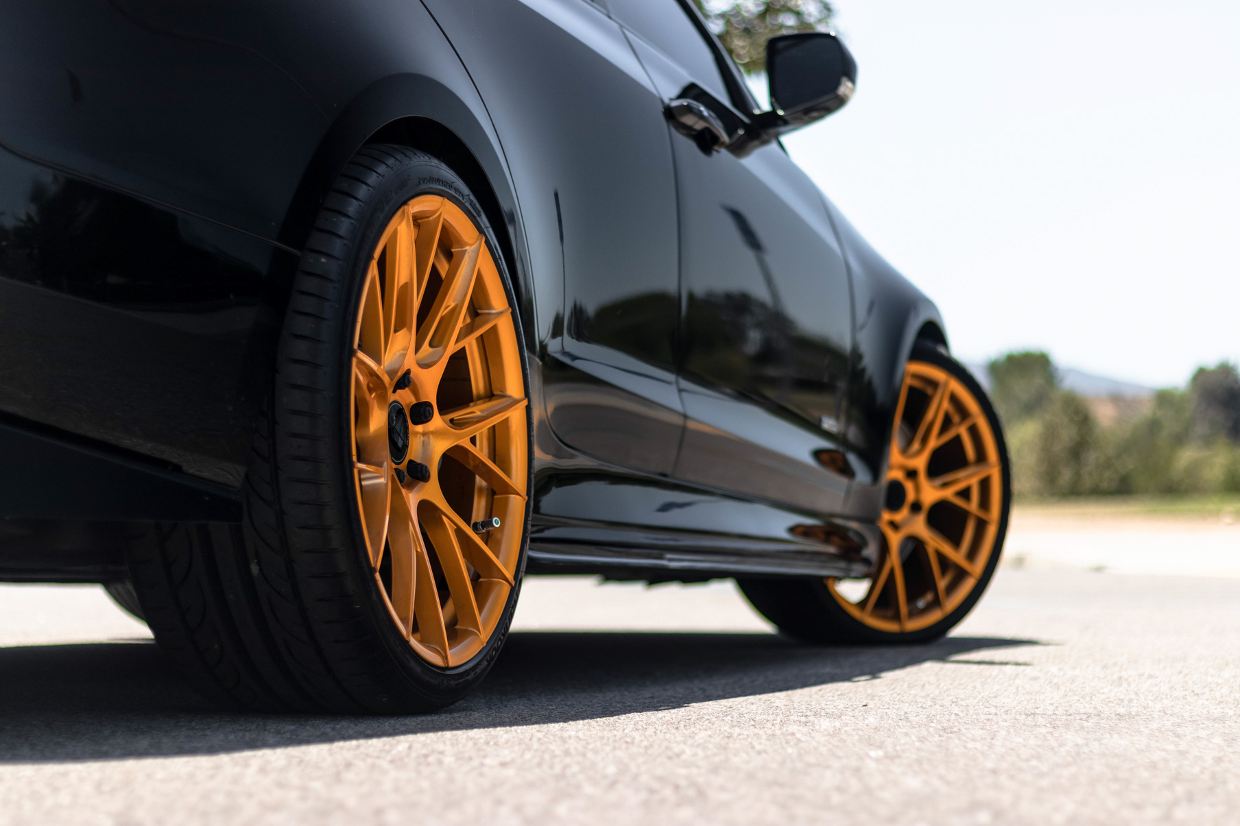 A 2017 Cadillac ATSV on 20 Inch Blaque Diamond BD-F18 Gold Wheels
