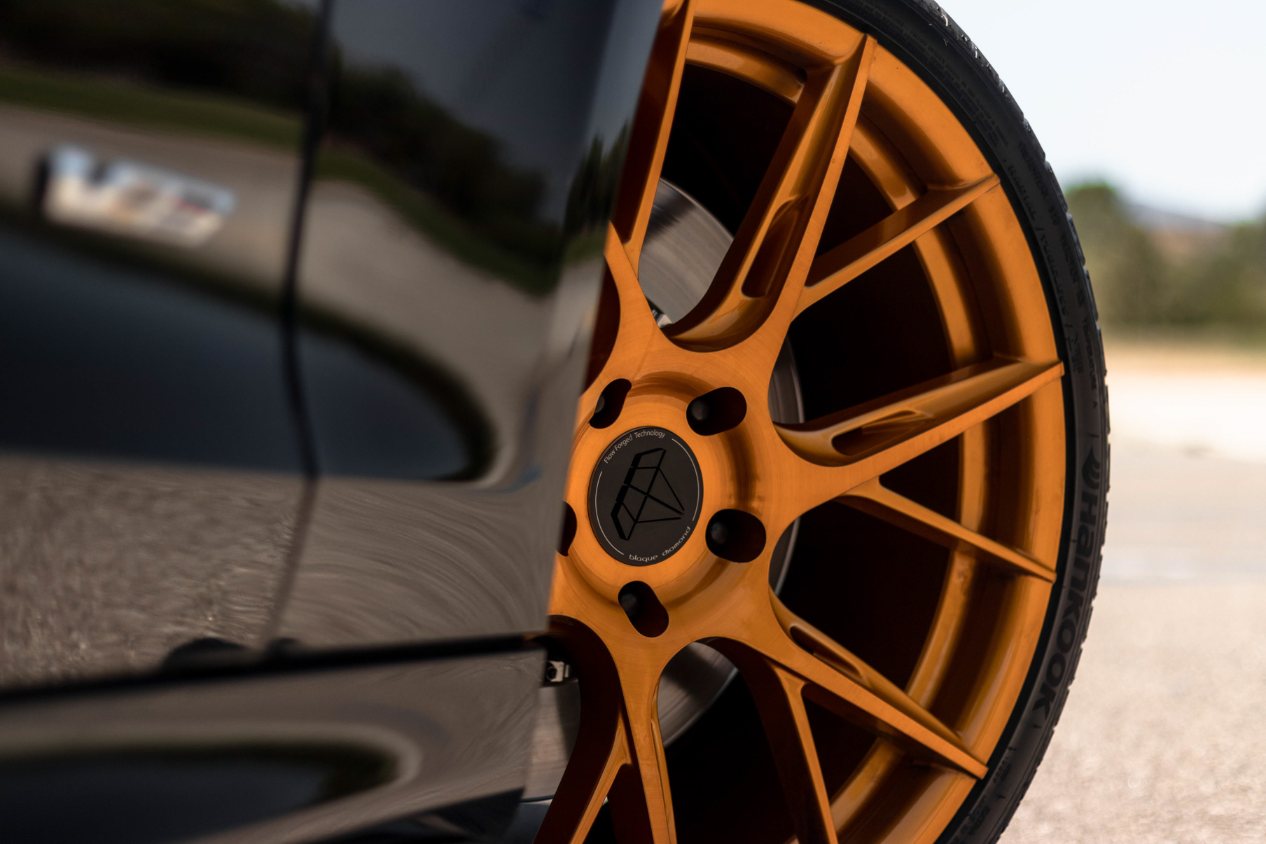 A 2017 Cadillac ATSV on 20 Inch Blaque Diamond BD-F18 Gold Wheels