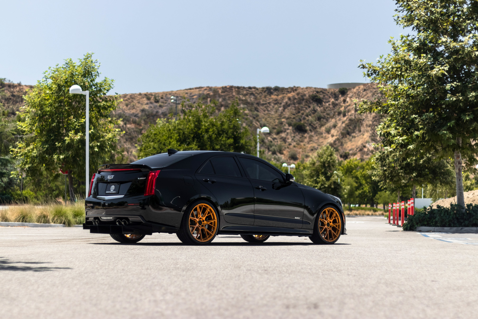 A 2017 Cadillac ATSV on 20 Inch Blaque Diamond BD-F18 Gold Wheels