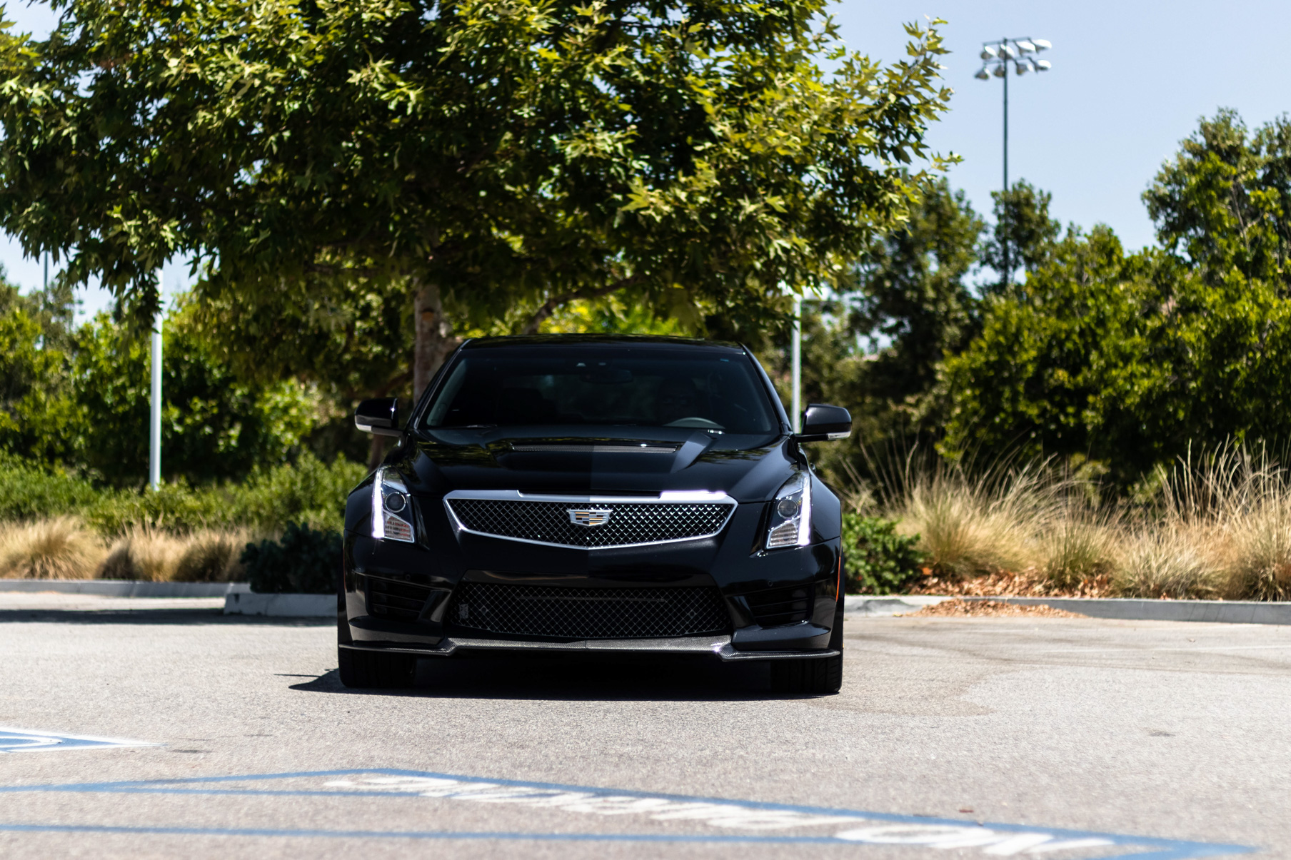 A 2017 Cadillac ATSV on 20 Inch Blaque Diamond BD-F18 Gold Wheels