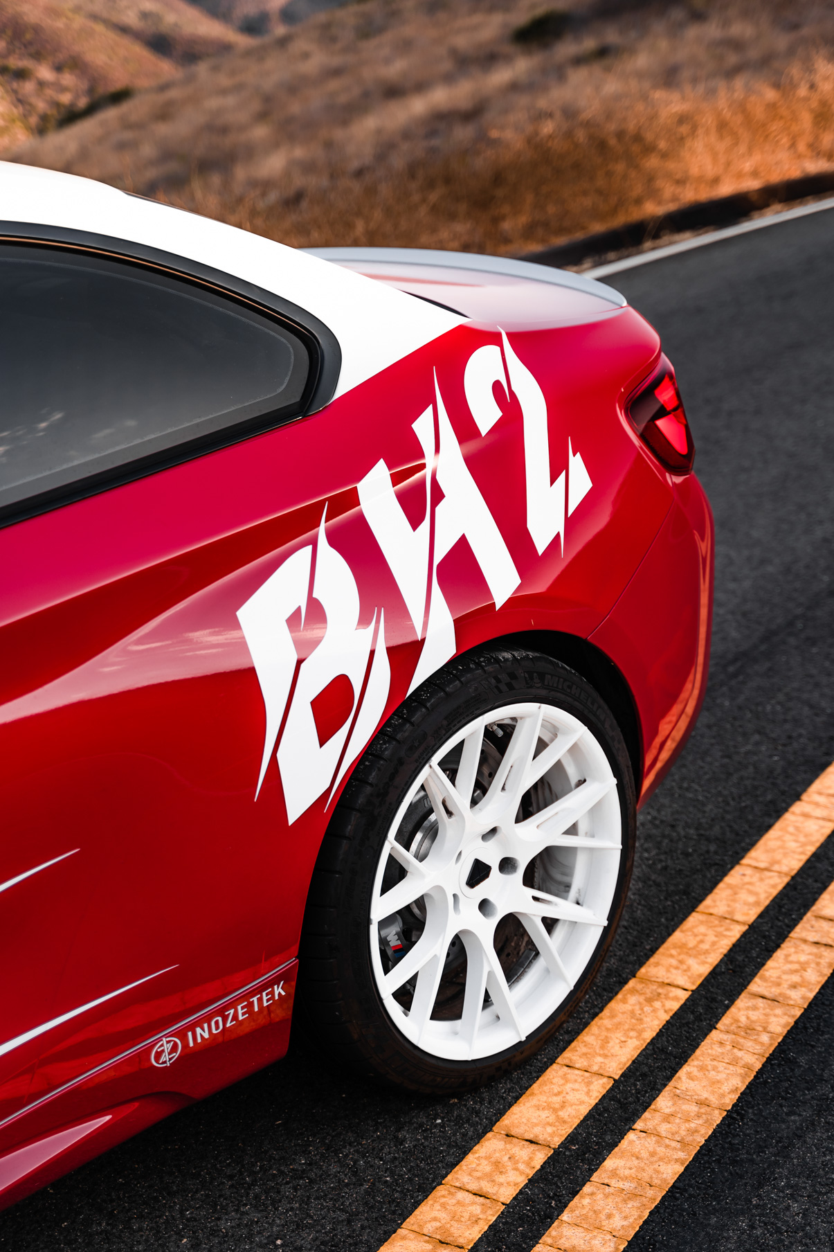 A 2020 BMW M2 on 20 Inch Blaque Diamond BD-F18 Gloss White Wheels