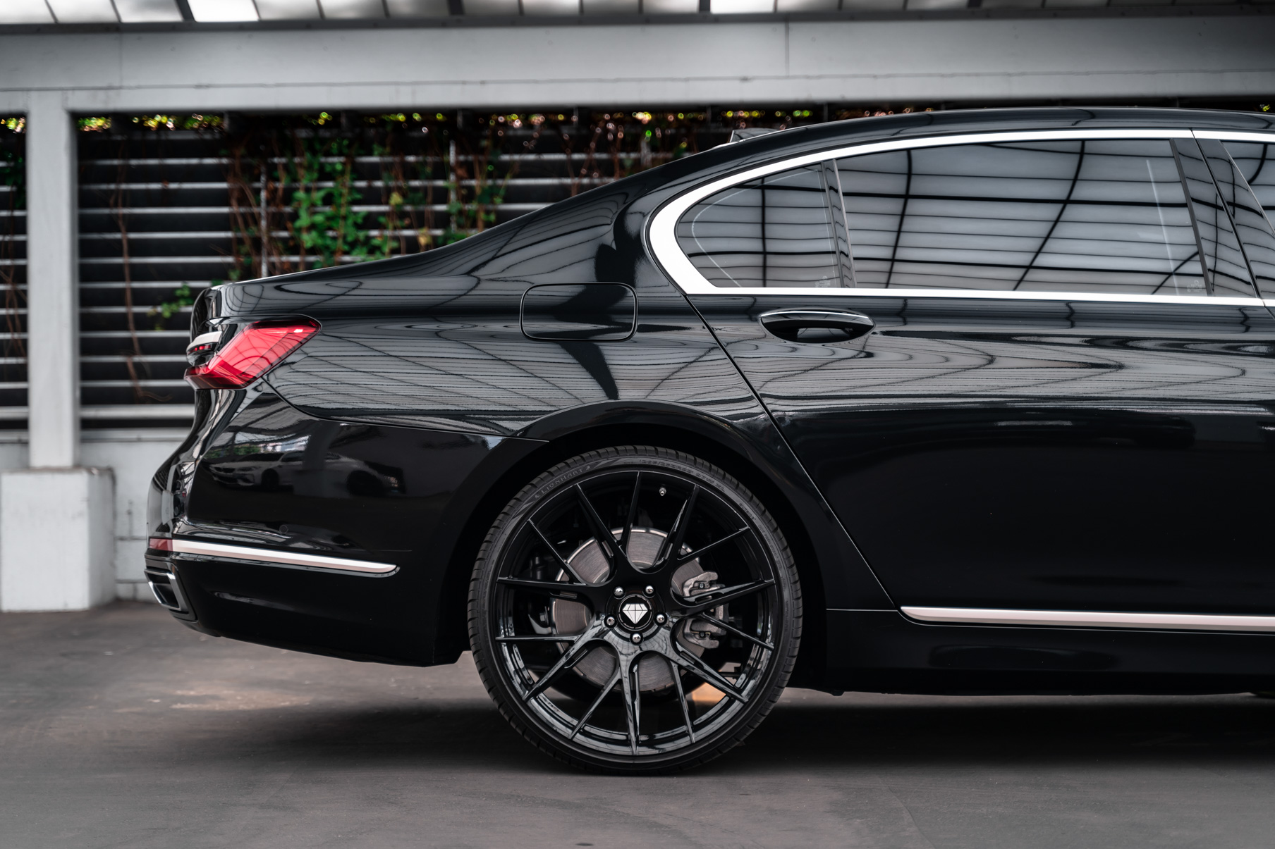 A 2020 BMW 740i on 20 Inch Blaque Diamond BD-F18 Gloss Black Wheels