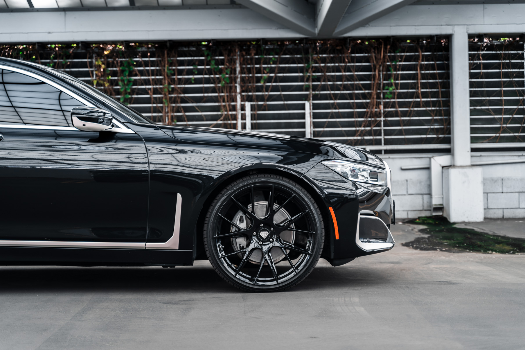 A 2020 BMW 740i on 20 Inch Blaque Diamond BD-F18 Gloss Black Wheels