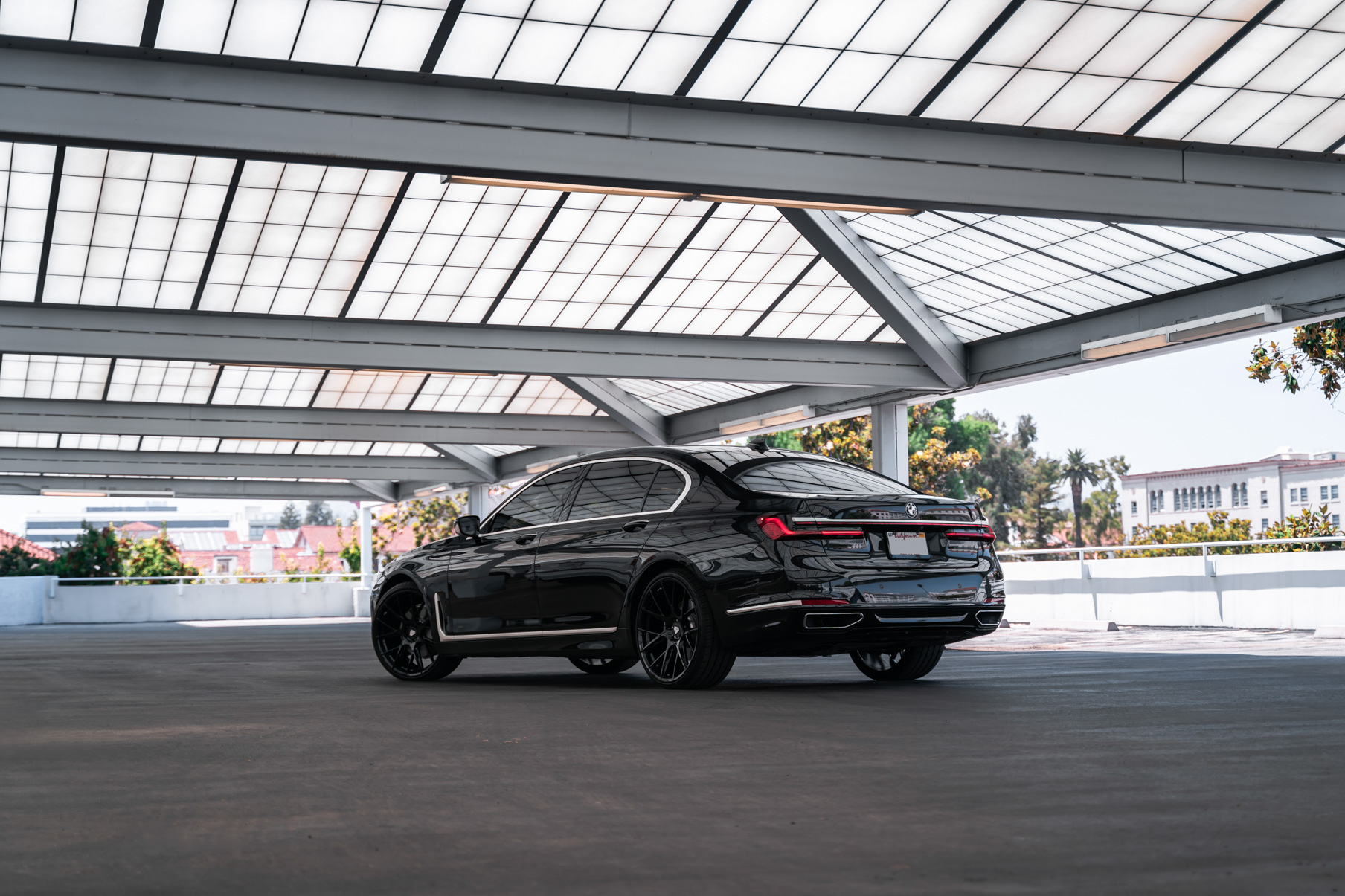 A 2020 BMW 740i on 20 Inch Blaque Diamond BD-F18 Gloss Black Wheels