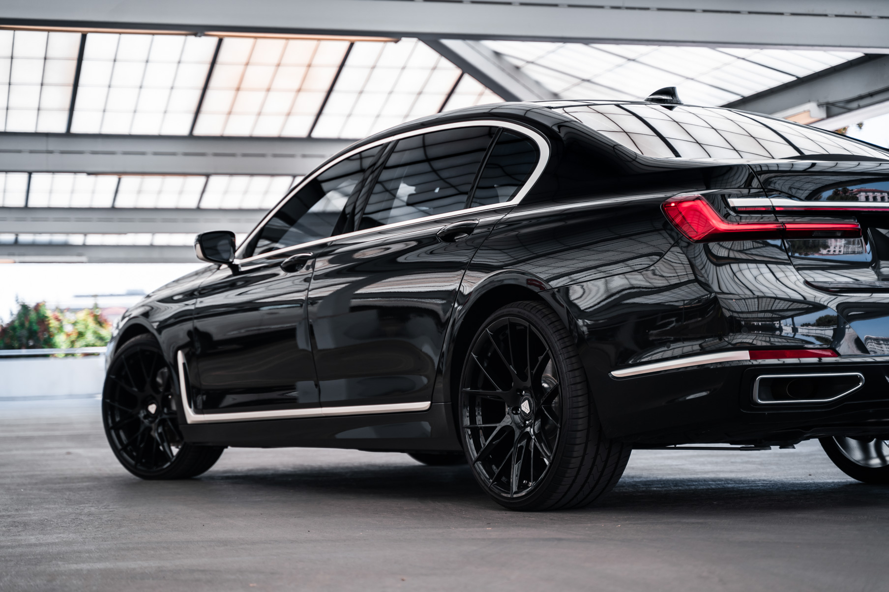 A 2020 BMW 740i on 20 Inch Blaque Diamond BD-F18 Gloss Black Wheels