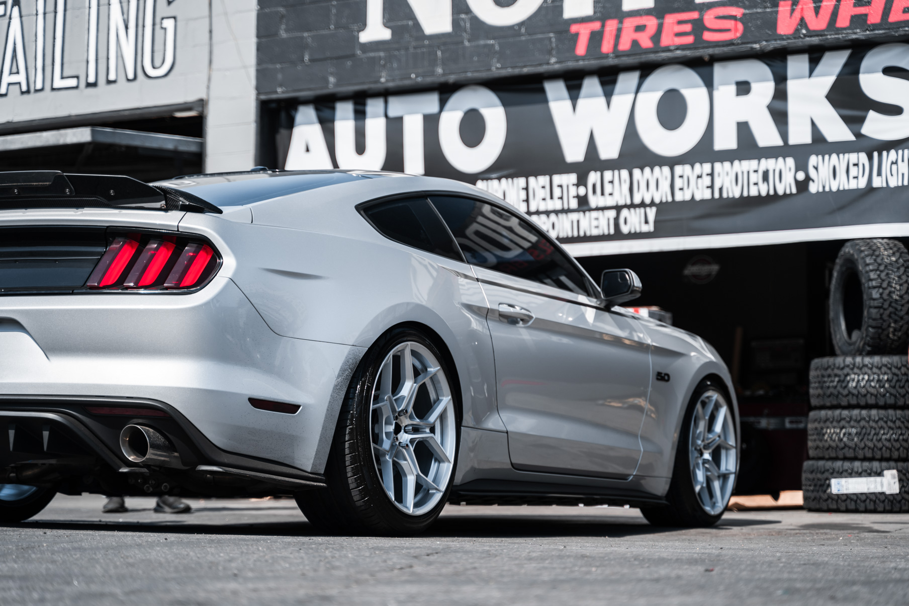 A 2016 Ford Mustang GT on 20 Inch Blaque Diamond BD-F25 Brushed Silver Wheels