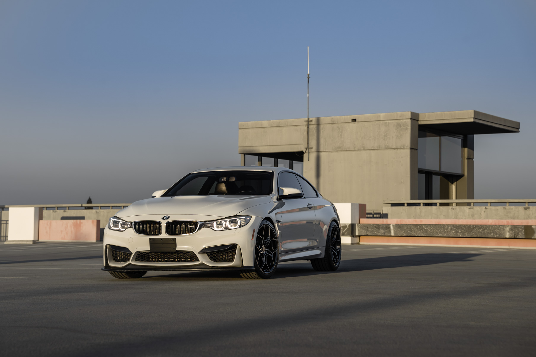 A 2015 BMW M4 on 20 Inch Blaque Diamond BD-F25 Gloss Black Wheels