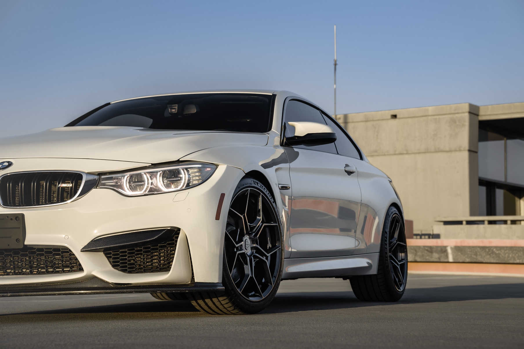 A 2015 BMW M4 on 20 Inch Blaque Diamond BD-F25 Gloss Black Wheels