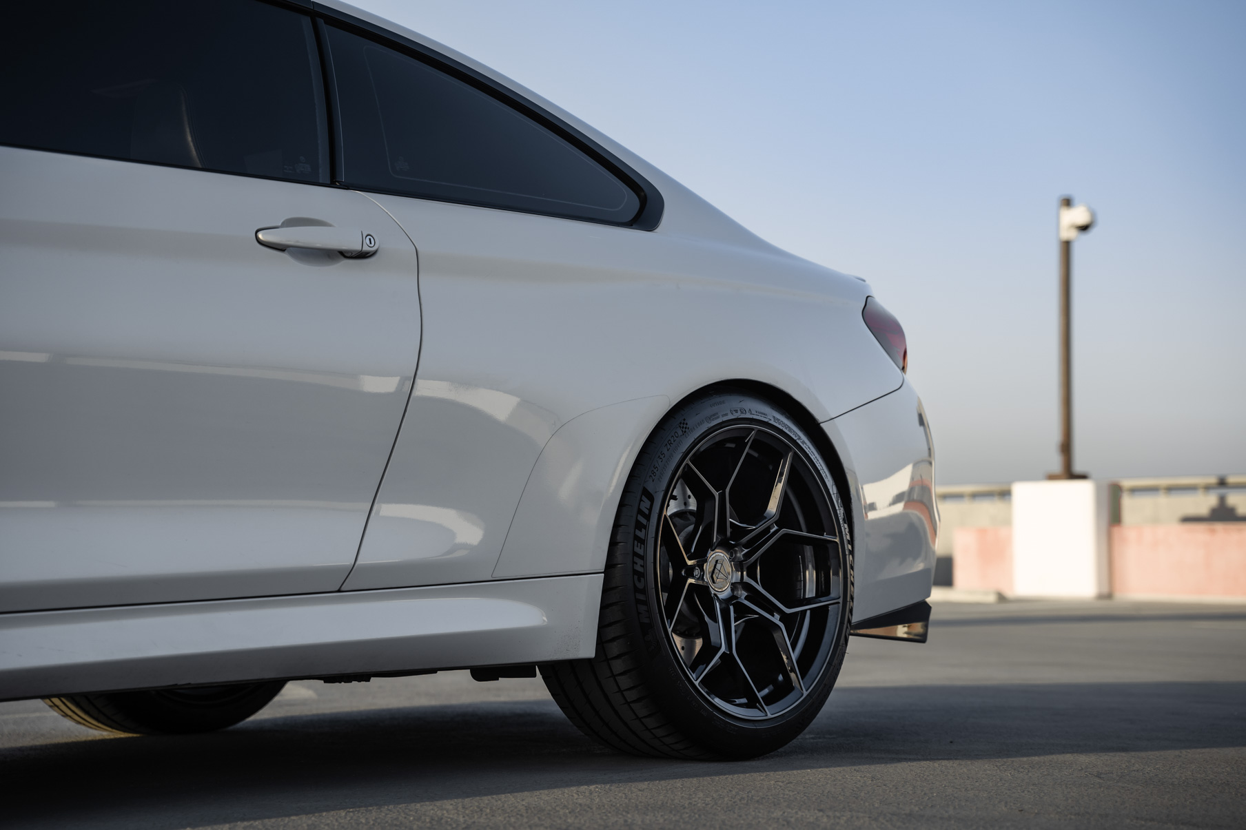 A 2015 BMW M4 on 20 Inch Blaque Diamond BD-F25 Gloss Black Wheels