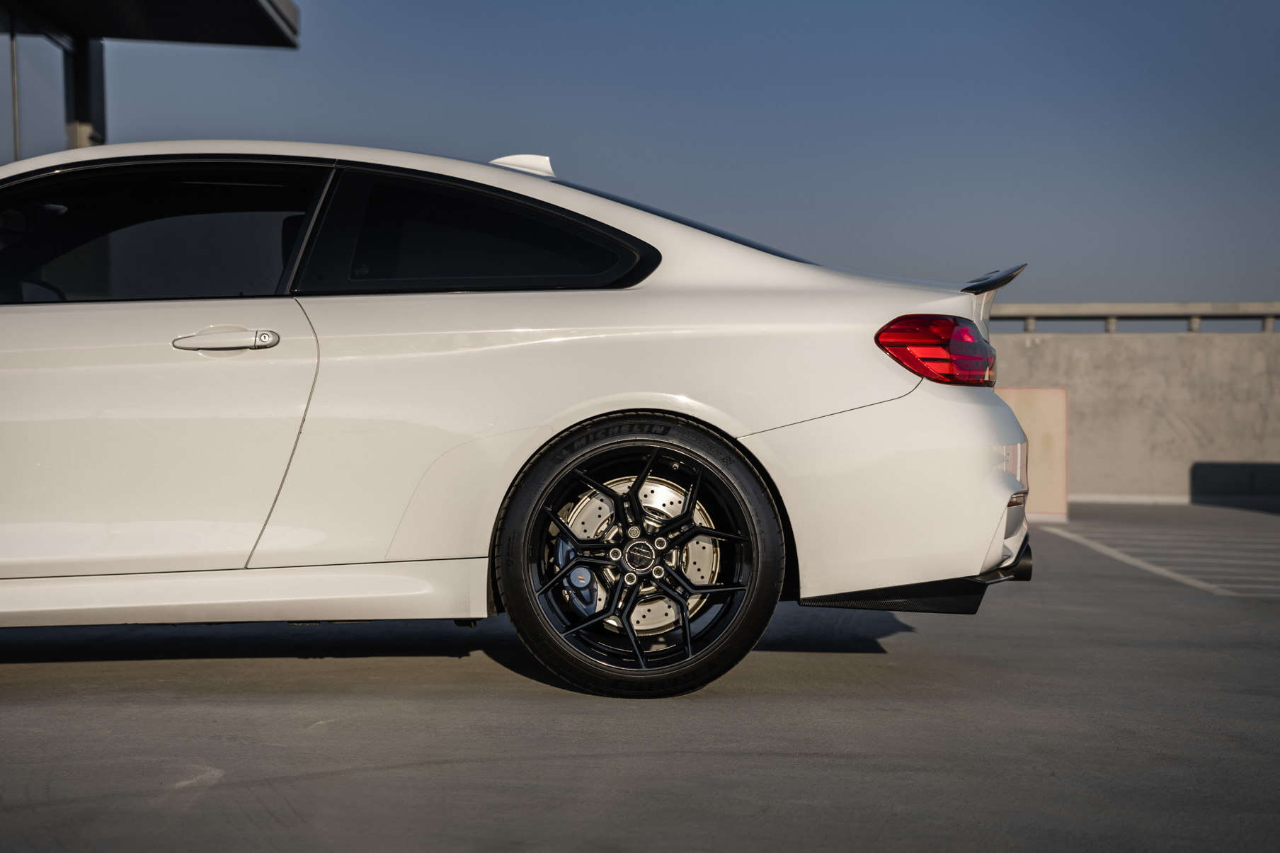 A 2015 BMW M4 on 20 Inch Blaque Diamond BD-F25 Gloss Black Wheels
