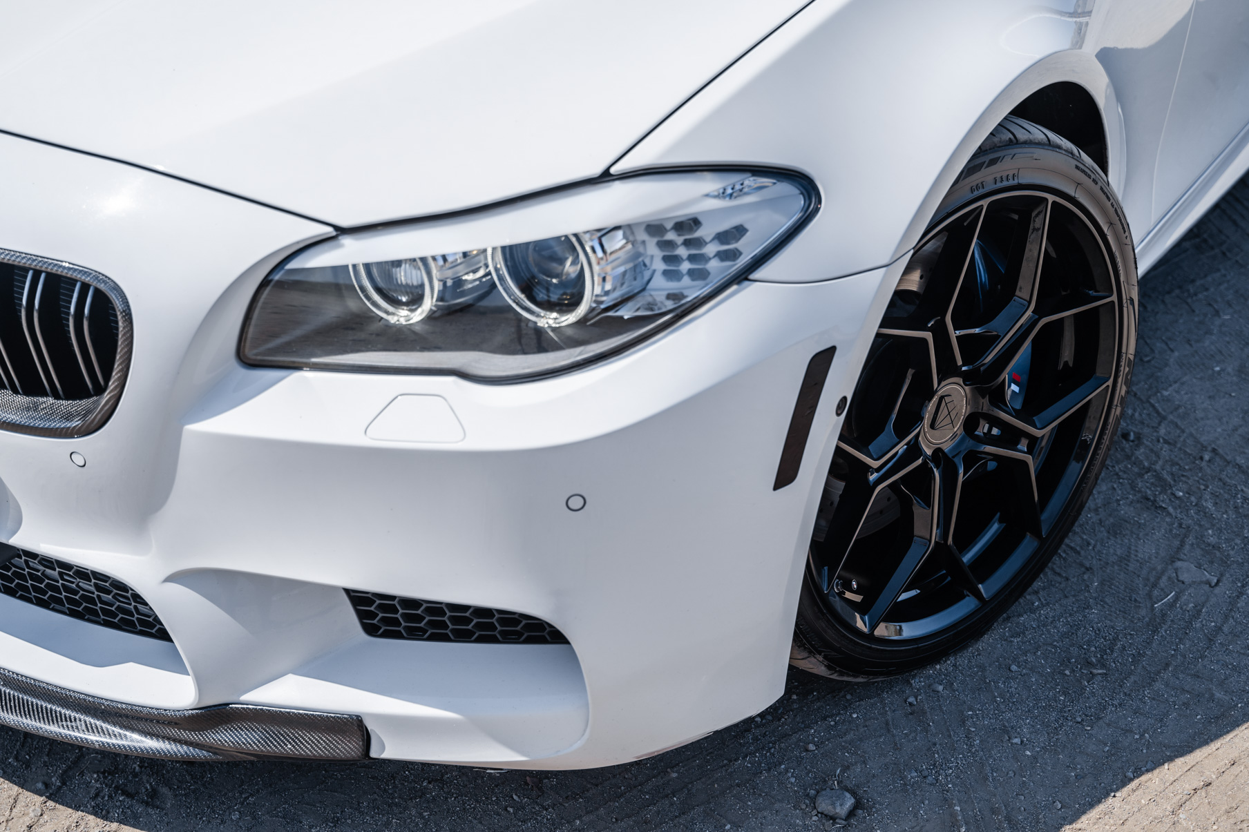 A 2013 BMW M5 on 20 Inch BD-F25 Gloss Black Wheels