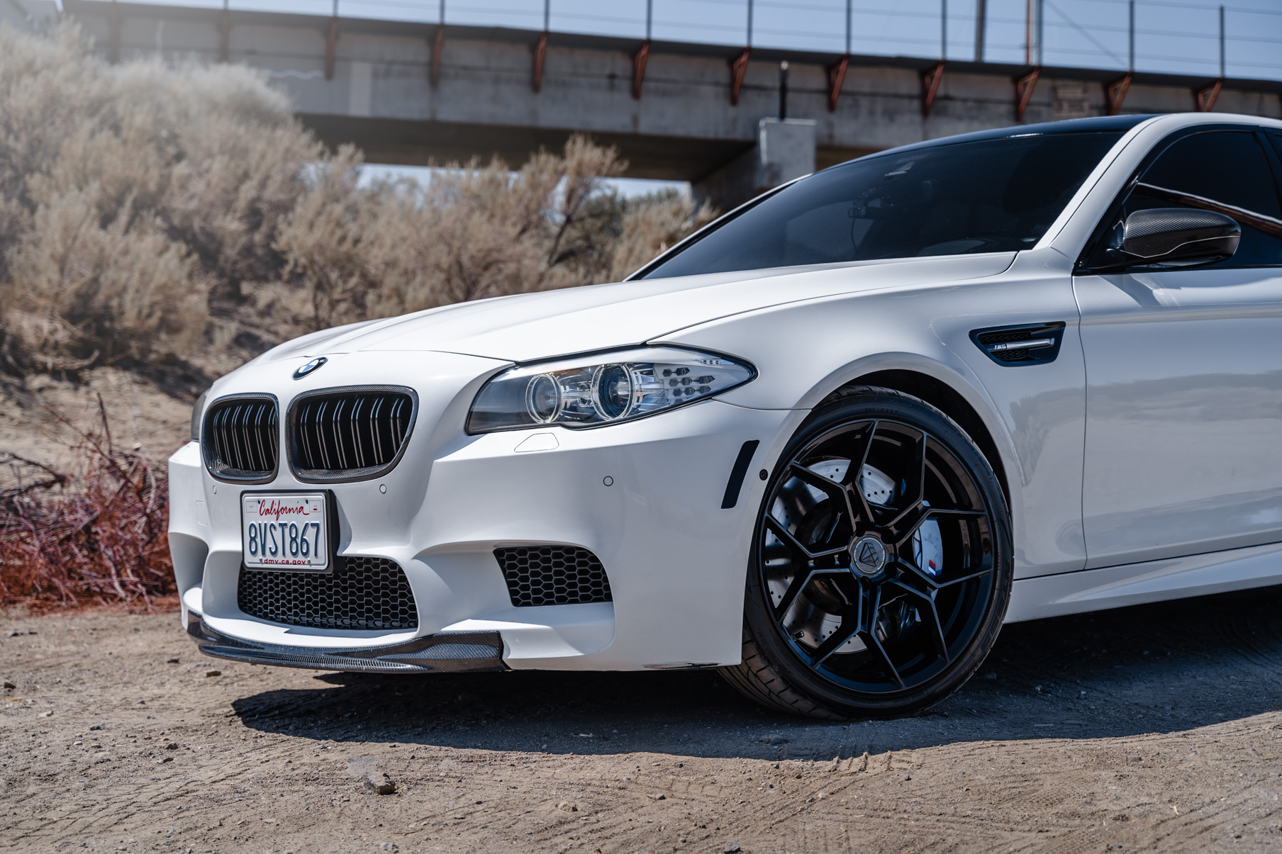 A 2013 BMW M5 on 20 Inch BD-F25 Gloss Black Wheels