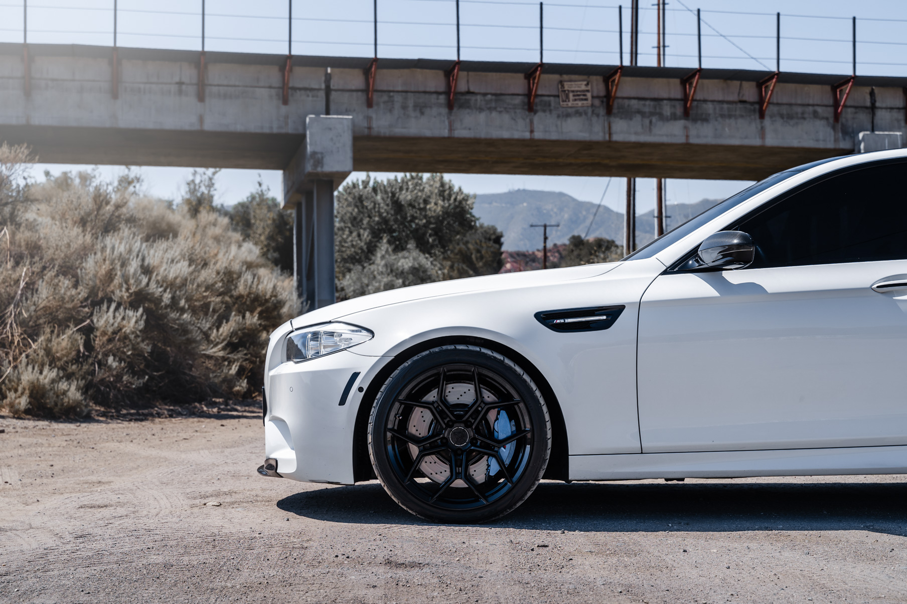 A 2013 BMW M5 on 20 Inch BD-F25 Gloss Black Wheels