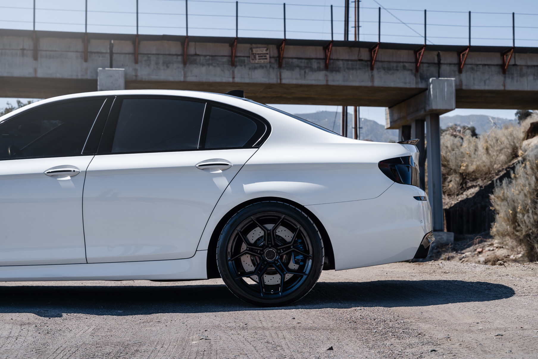 A 2013 BMW M5 on 20 Inch BD-F25 Gloss Black Wheels