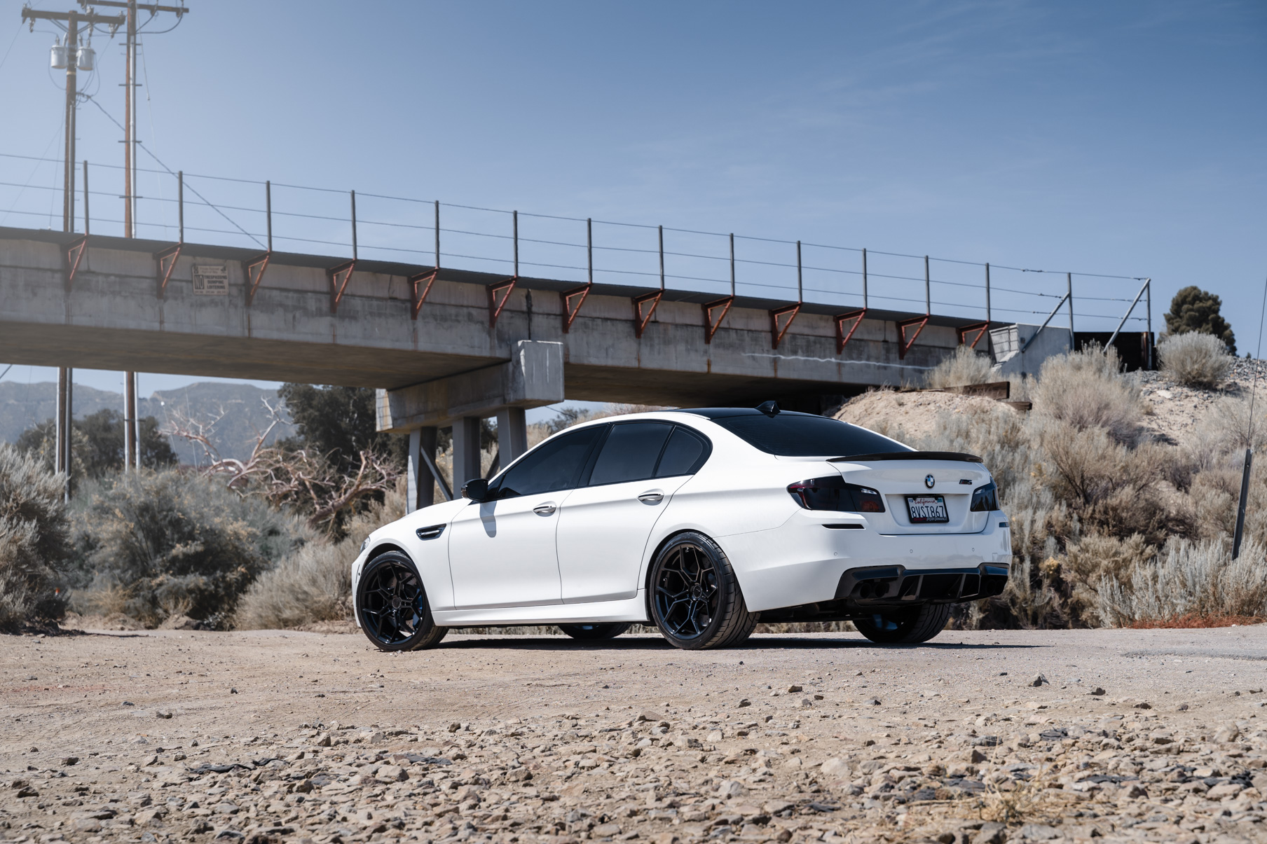 A 2013 BMW M5 on 20 Inch BD-F25 Gloss Black Wheels