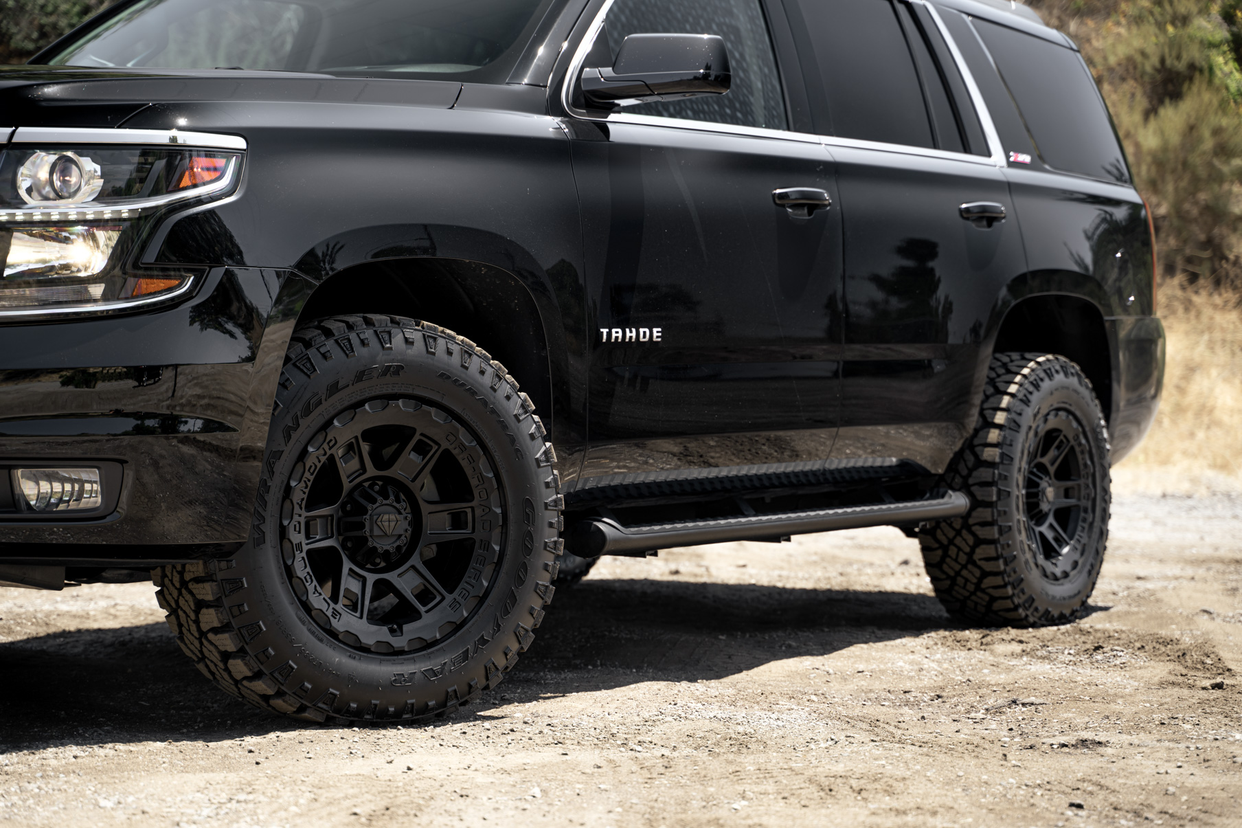 A 2017 Chevrolet Tahoe on 18 Inch Blaque Diamond BD-0801 Textured Black Wheels