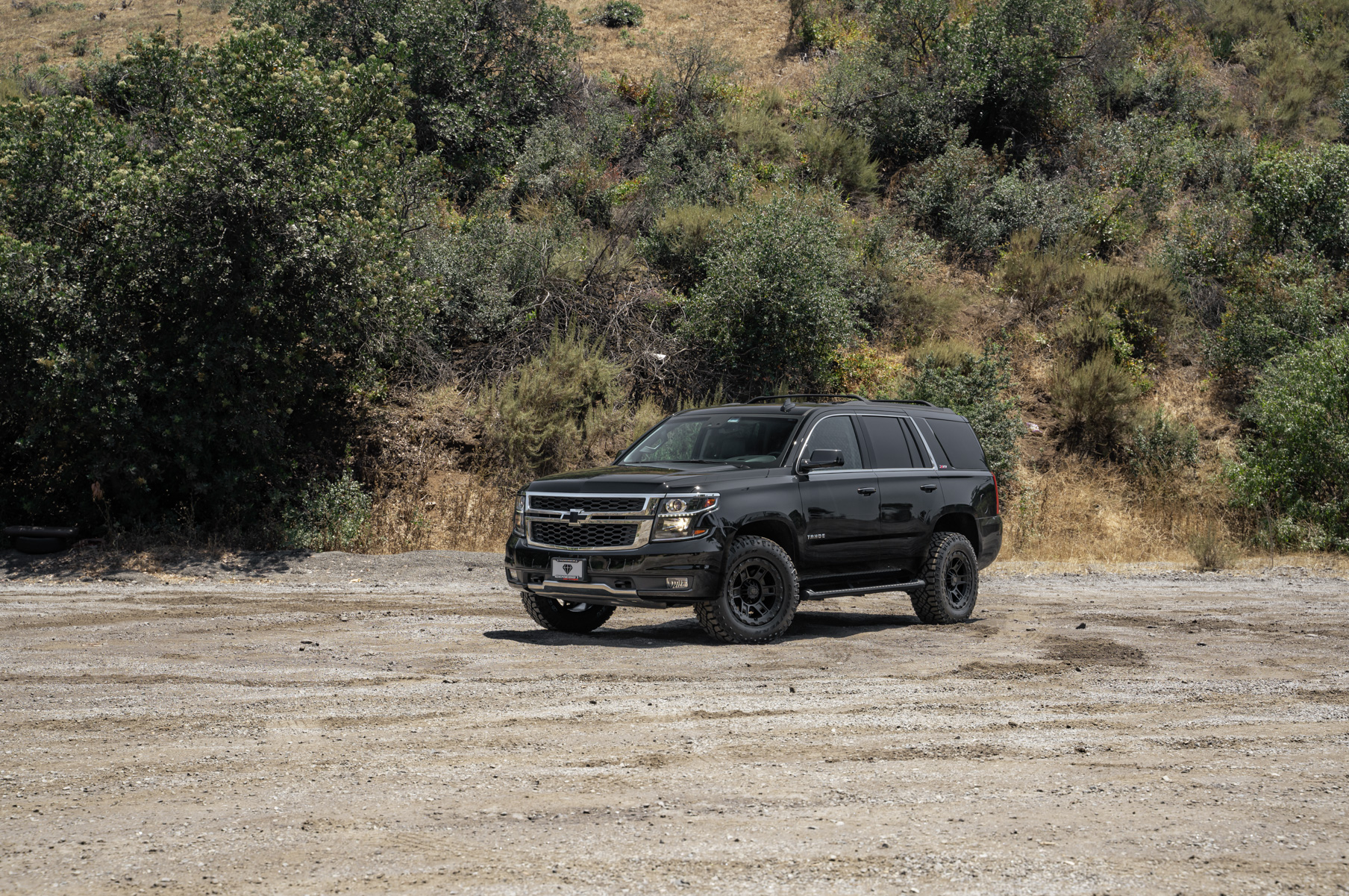 A 2017 Chevrolet Tahoe on 18 Inch Blaque Diamond BD-0801 Textured Black Wheels