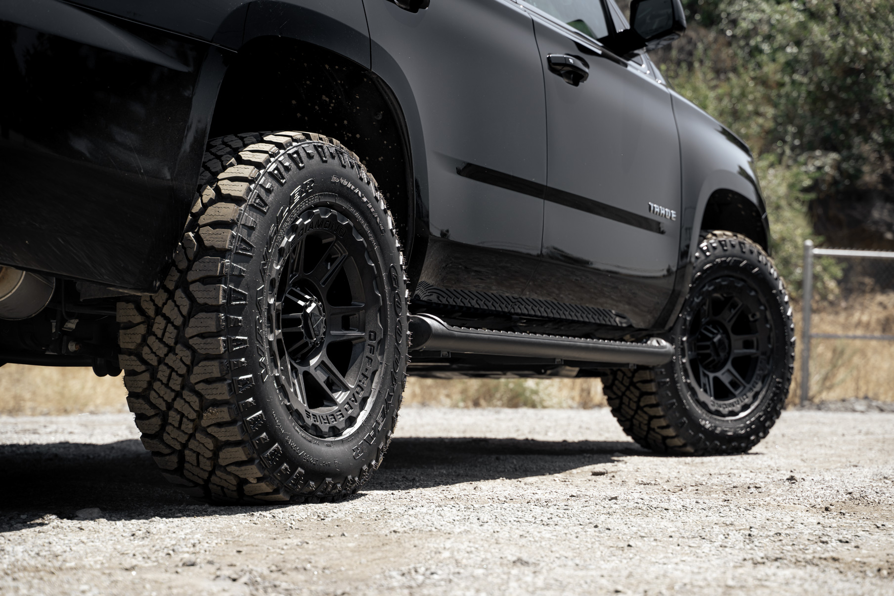 A 2017 Chevrolet Tahoe on 18 Inch Blaque Diamond BD-0801 Textured Black Wheels