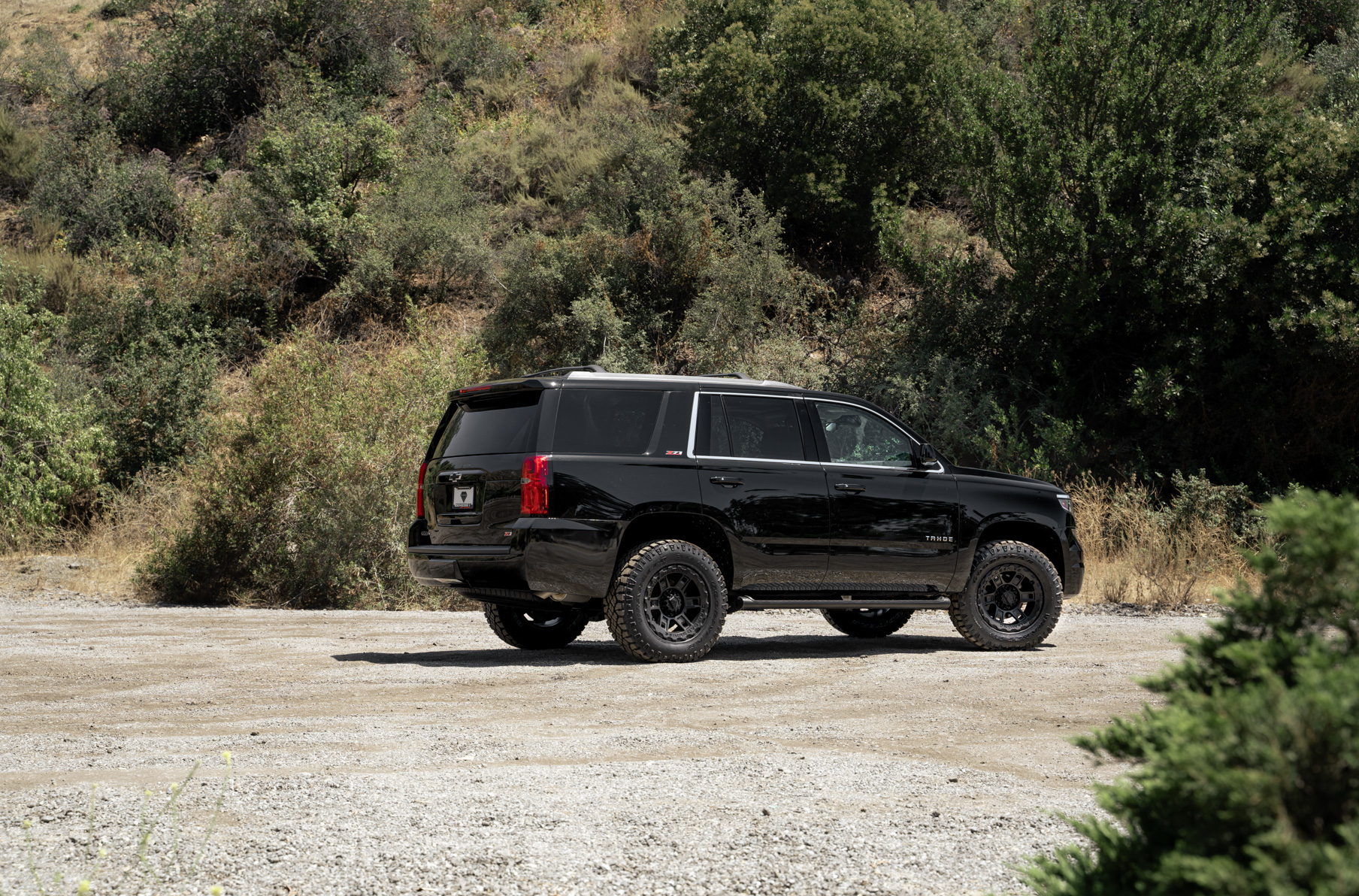 A 2017 Chevrolet Tahoe on 18 Inch Blaque Diamond BD-0801 Textured Black Wheels