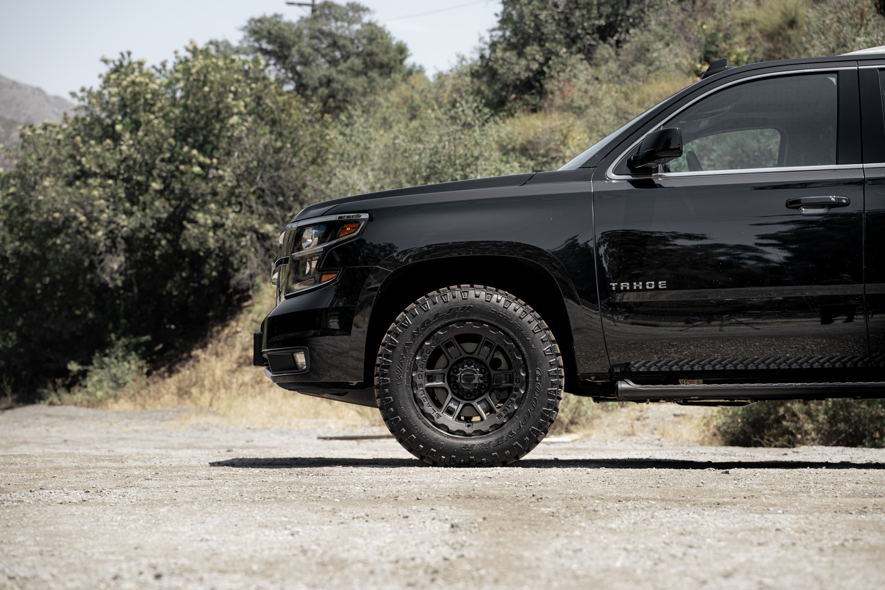 A 2017 Chevrolet Tahoe on 18 Inch Blaque Diamond BD-0801 Textured Black Wheels