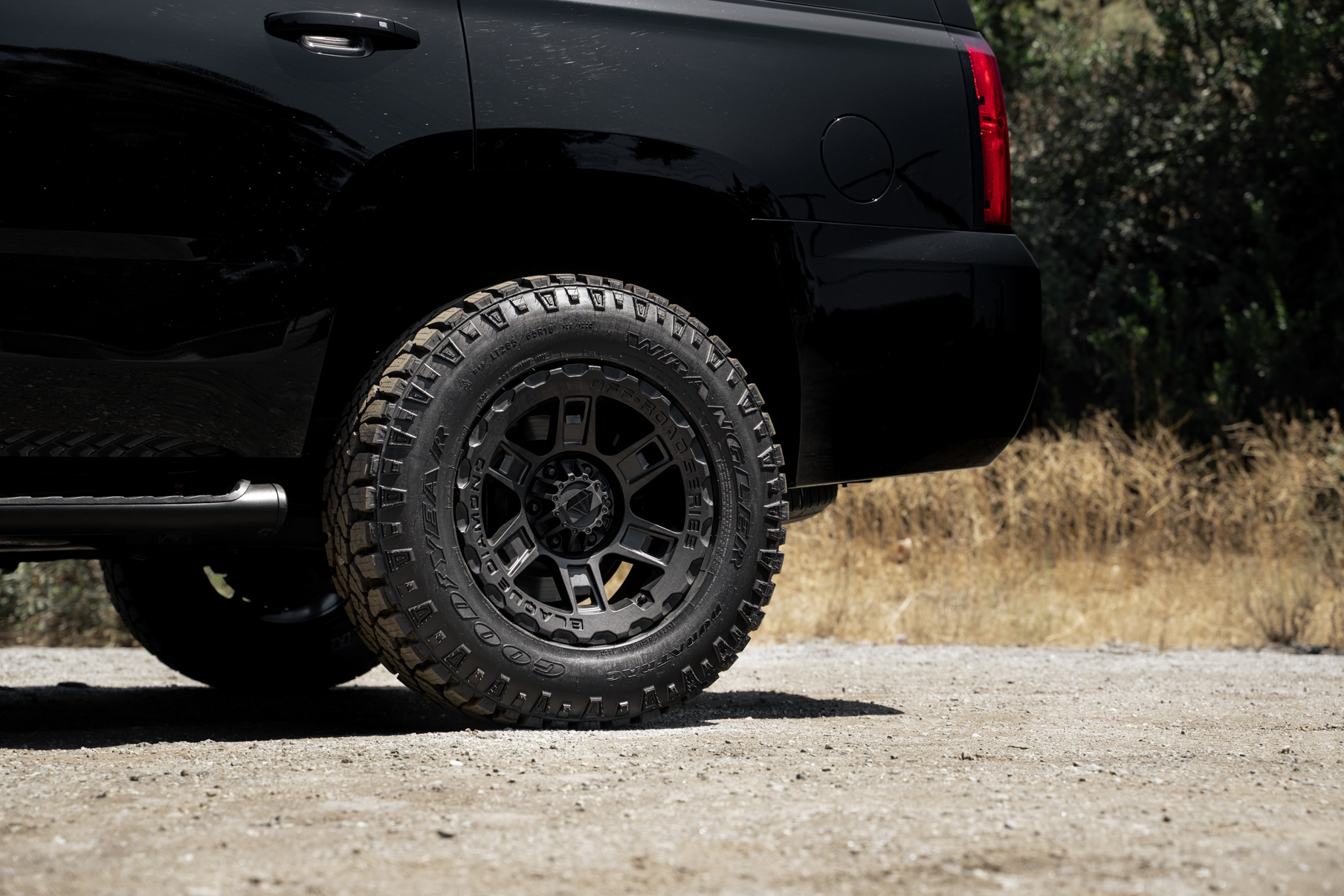 A 2017 Chevrolet Tahoe on 18 Inch Blaque Diamond BD-0801 Textured Black Wheels