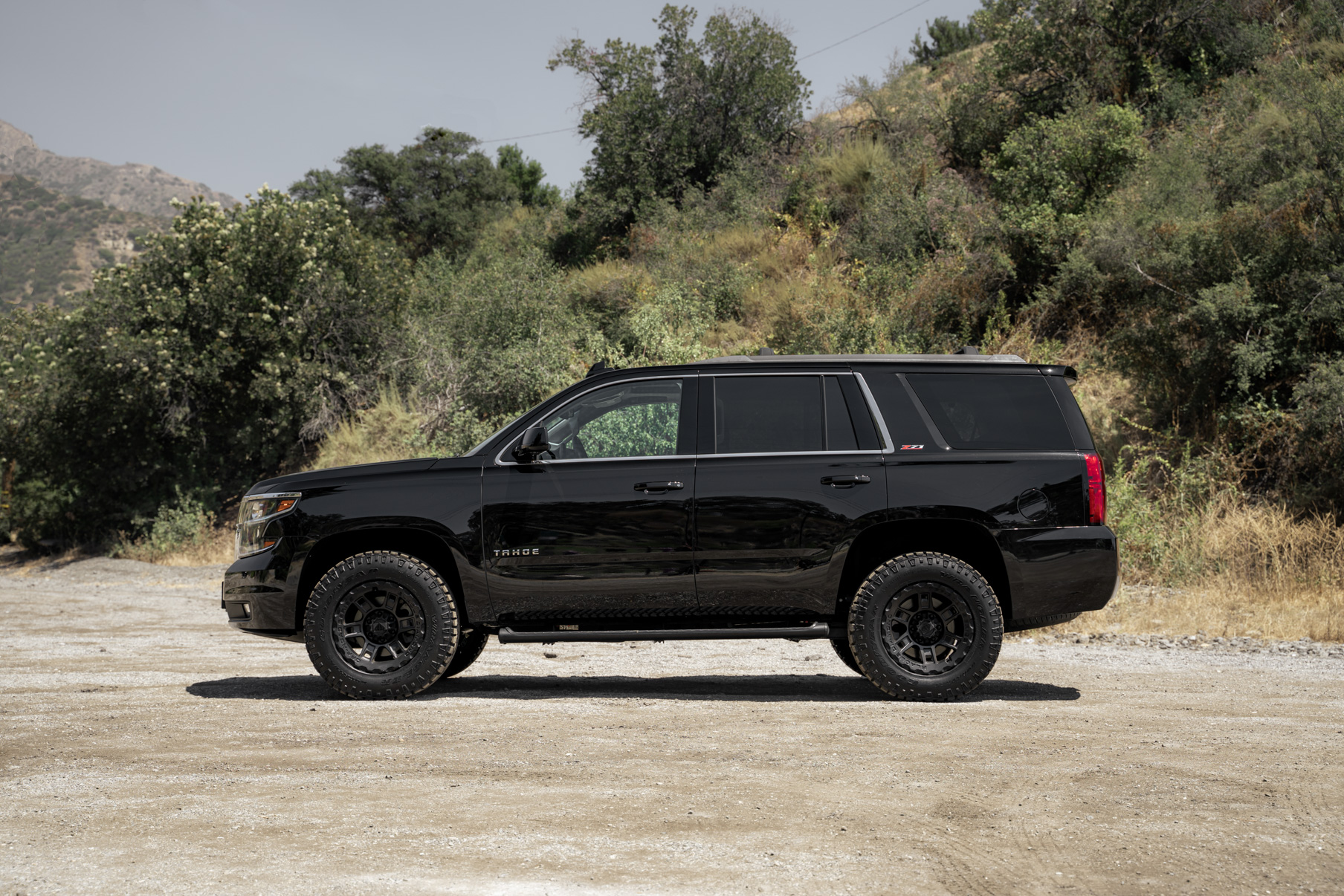 A 2017 Chevrolet Tahoe on 18 Inch Blaque Diamond BD-0801 Textured Black Wheels
