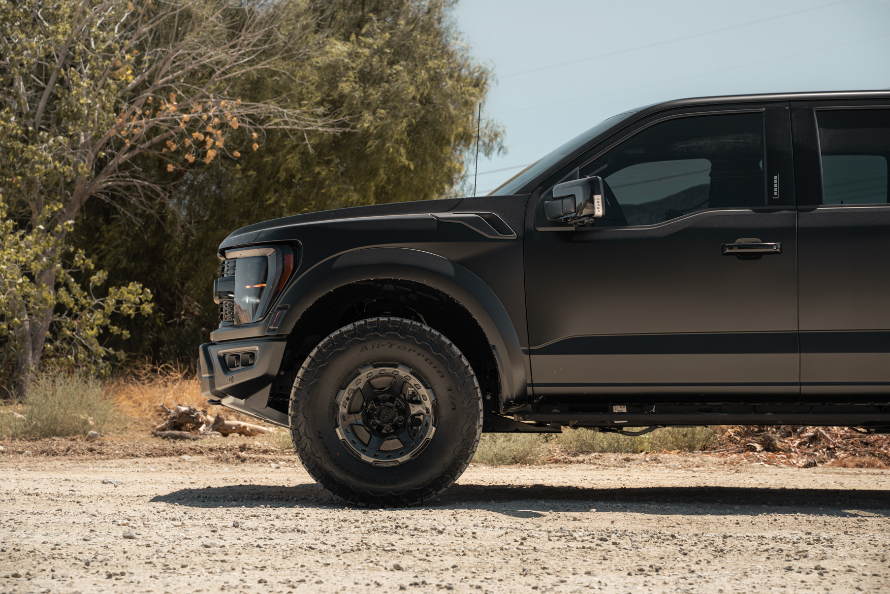 A 2022 Ford Raptor on Blaque Diamond BD-O728 Tinted Machined Black Wheels