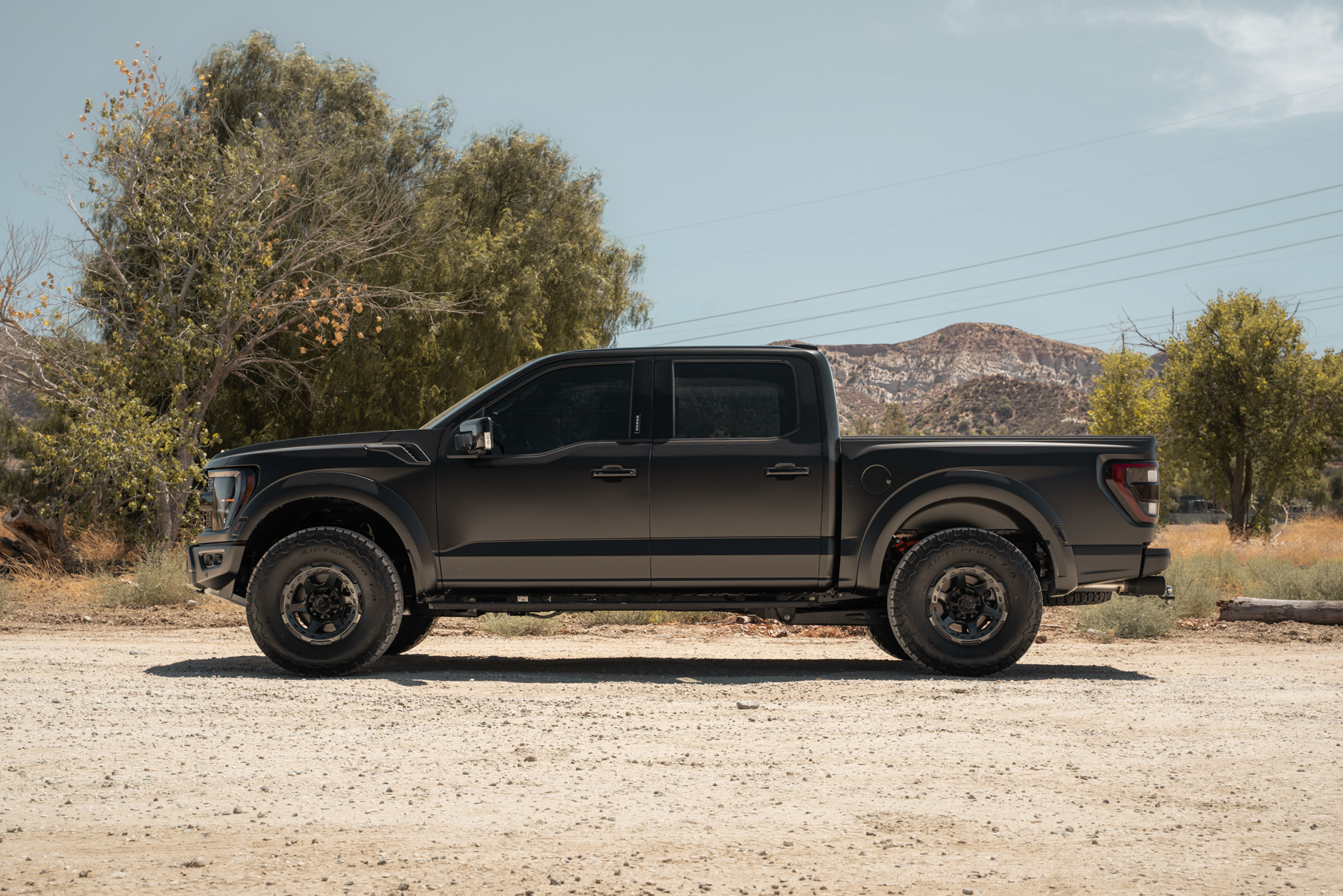 A 2022 Ford Raptor on Blaque Diamond BD-O728 Tinted Machined Black Wheels