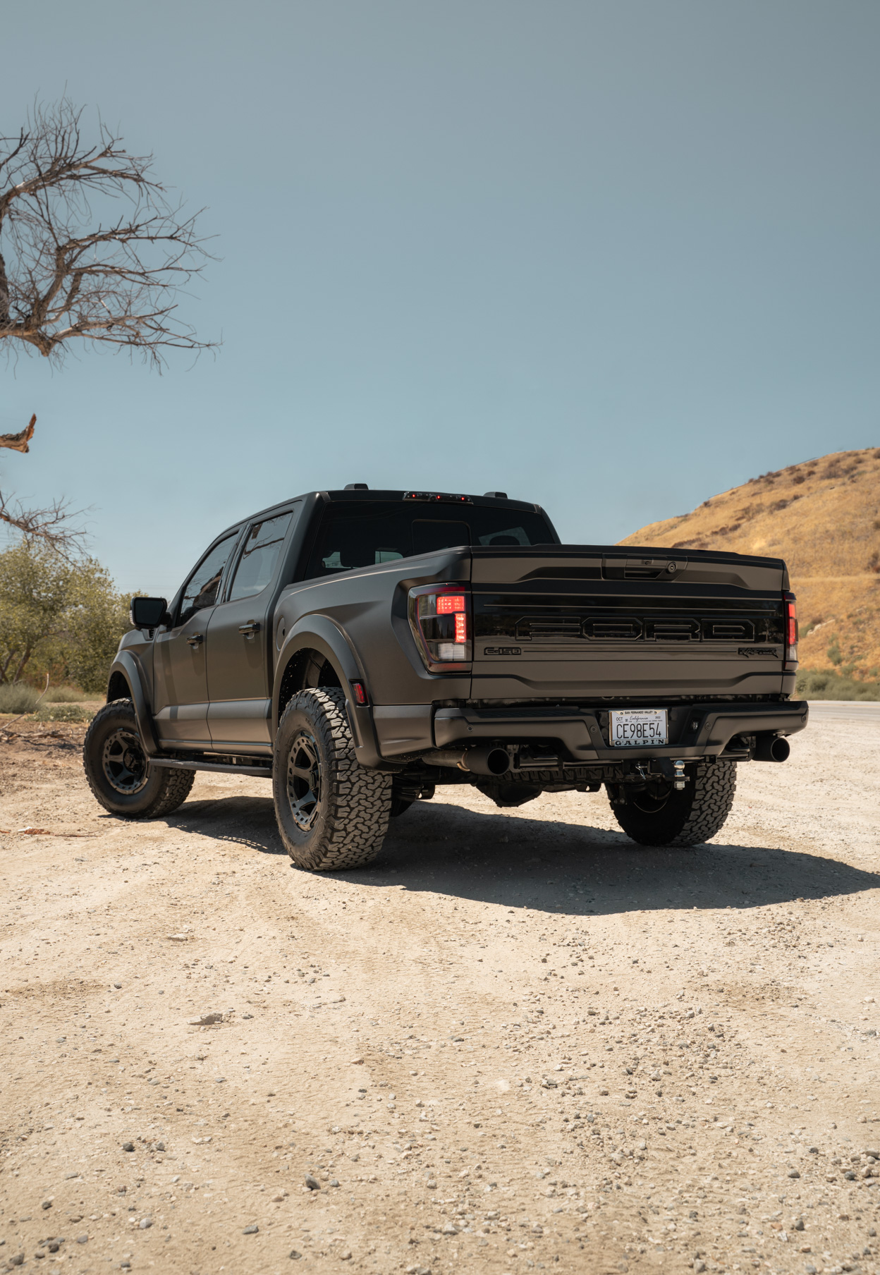 A 2022 Ford Raptor on Blaque Diamond BD-O728 Tinted Machined Black Wheels