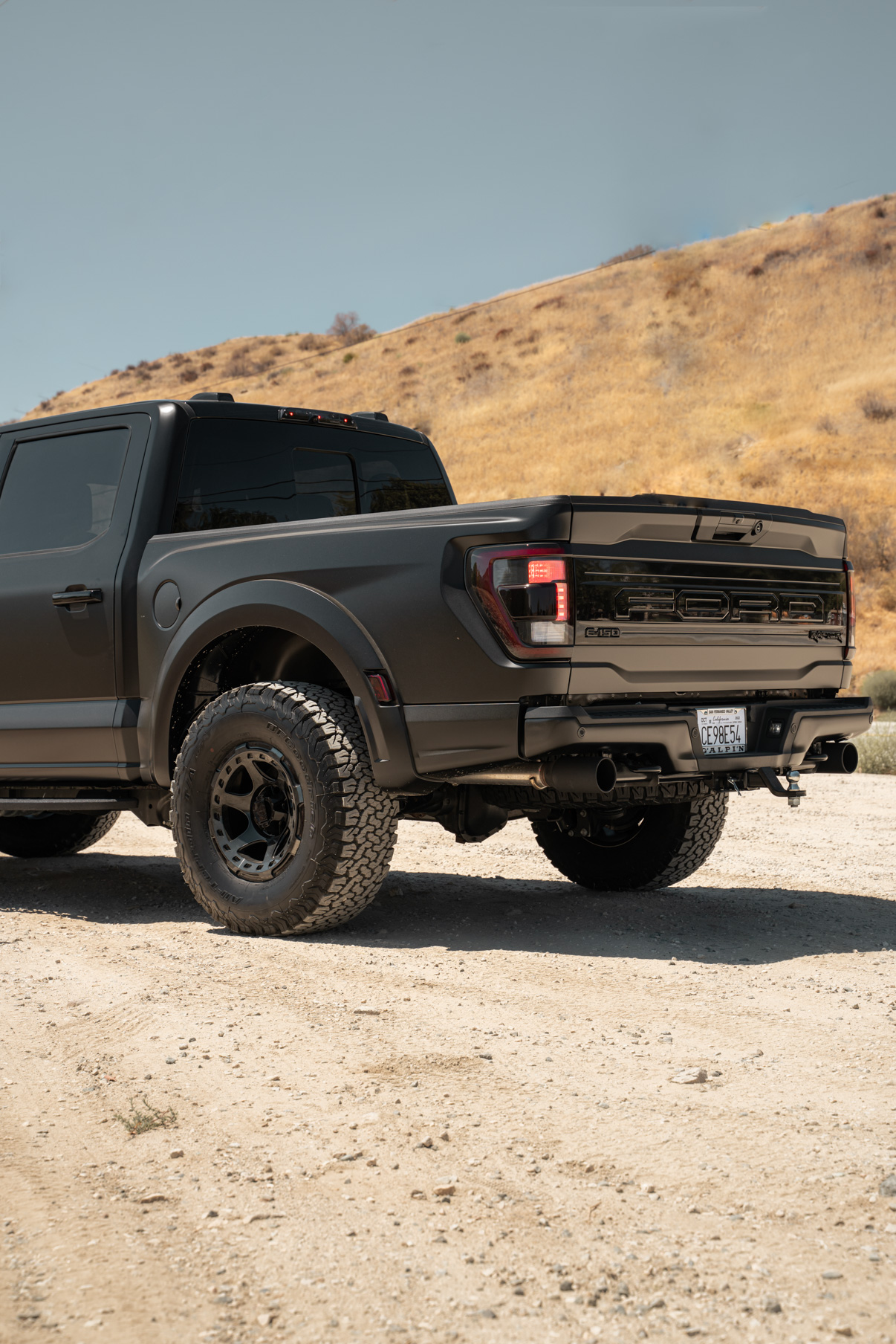 A 2022 Ford Raptor on Blaque Diamond BD-O728 Tinted Machined Black Wheels