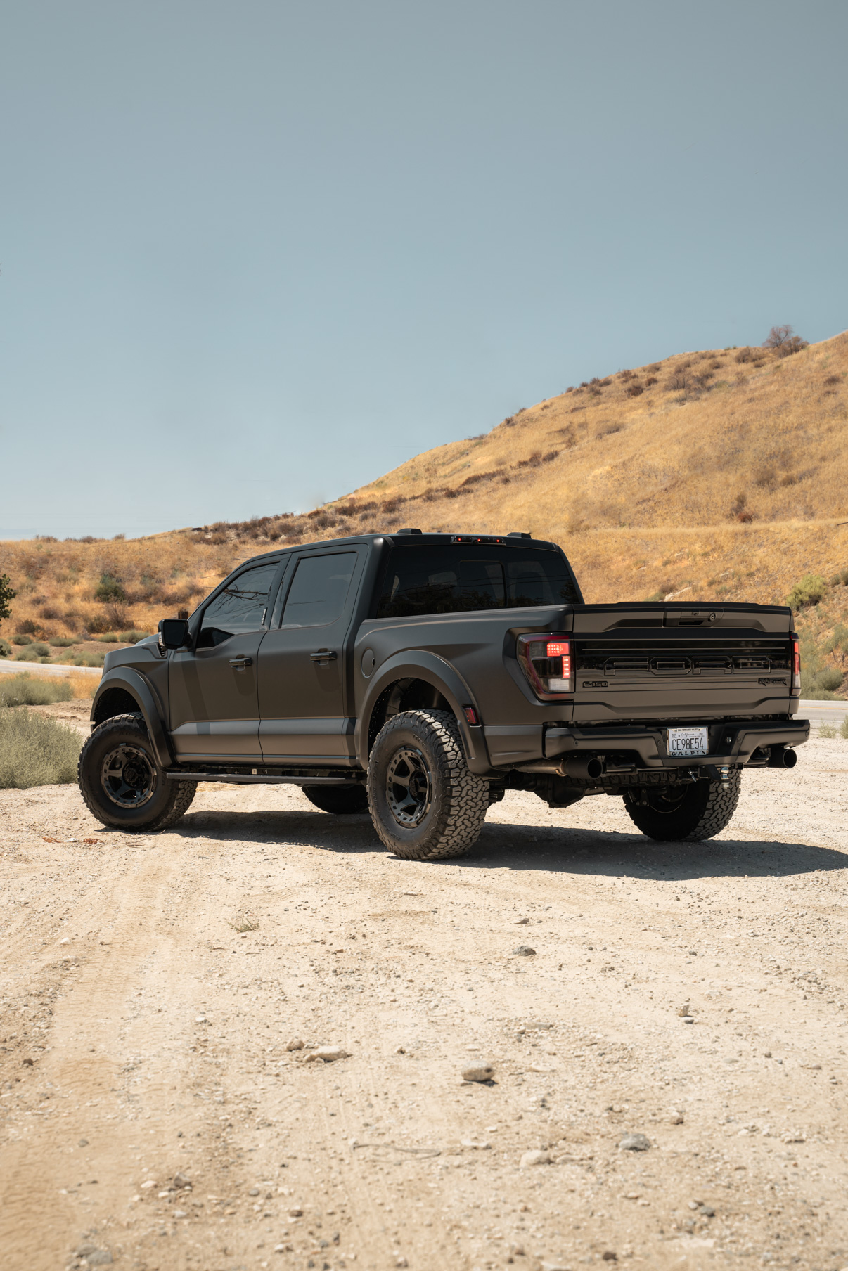 A 2022 Ford Raptor on Blaque Diamond BD-O728 Tinted Machined Black Wheels
