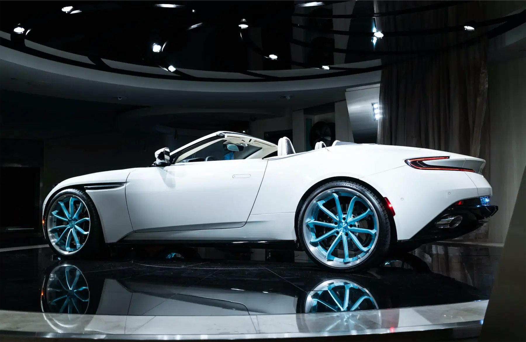 A 2017 Aston Martin DB11 on 20 Inch Blaque Diamond BD-23 Brushed Baby Blue Wheels