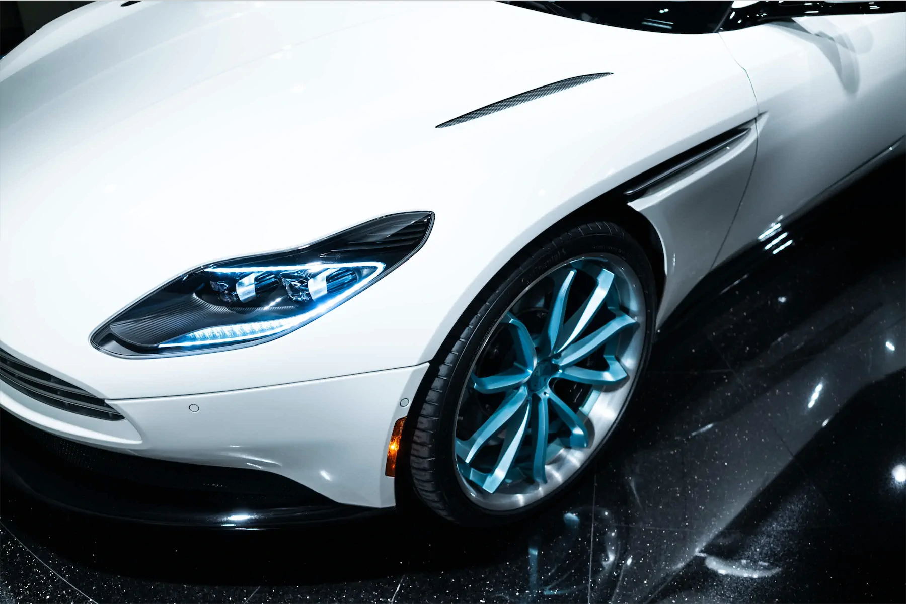 A 2017 Aston Martin DB11 on 20 Inch Blaque Diamond BD-23 Brushed Baby Blue Wheels