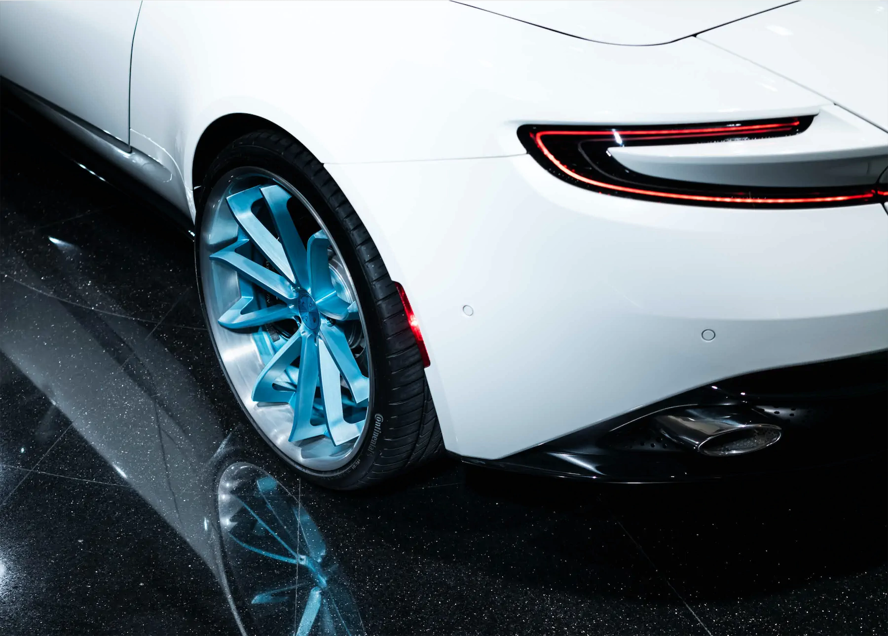 A 2017 Aston Martin DB11 on 20 Inch Blaque Diamond BD-23 Brushed Baby Blue Wheels