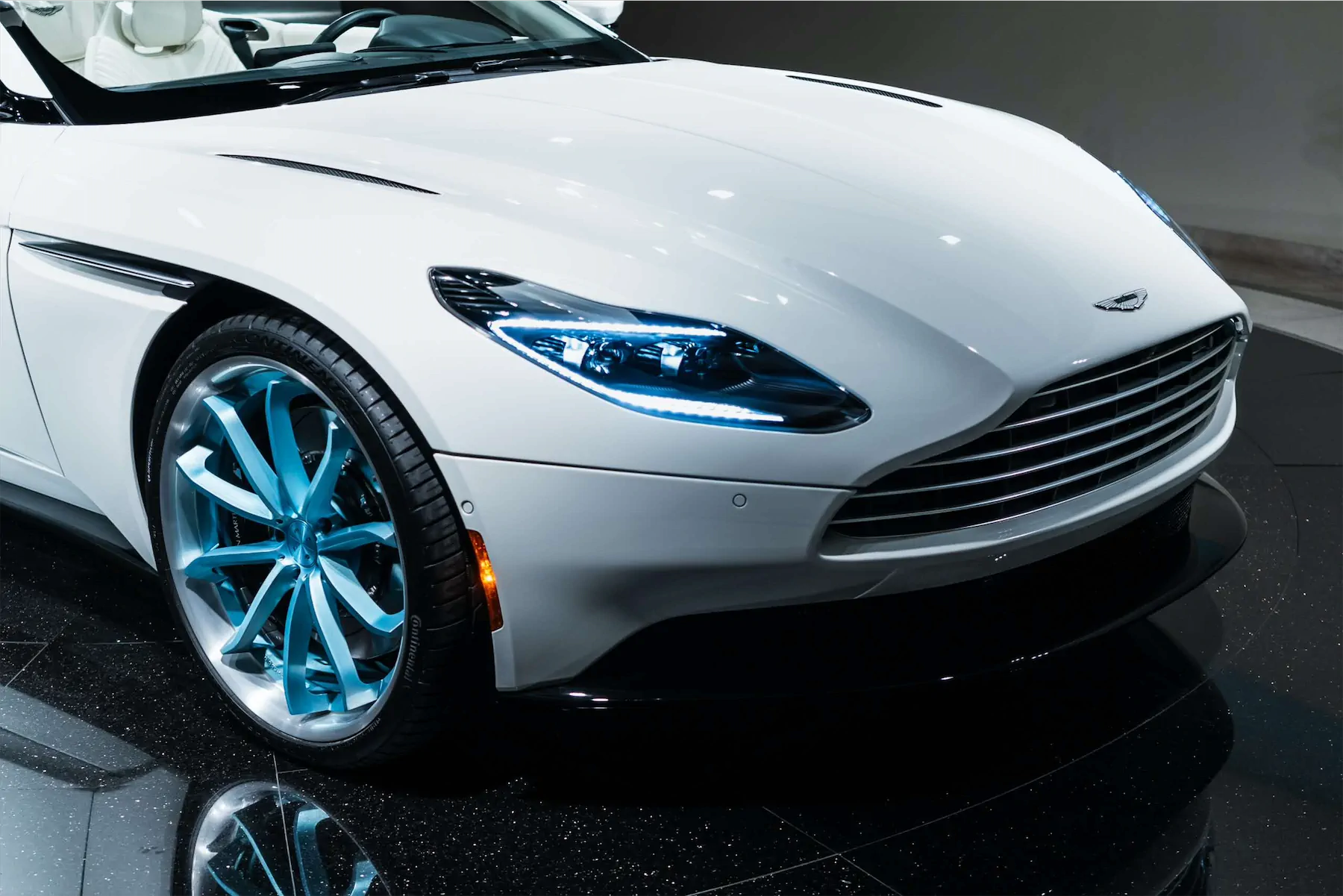 A 2017 Aston Martin DB11 on 20 Inch Blaque Diamond BD-23 Brushed Baby Blue Wheels