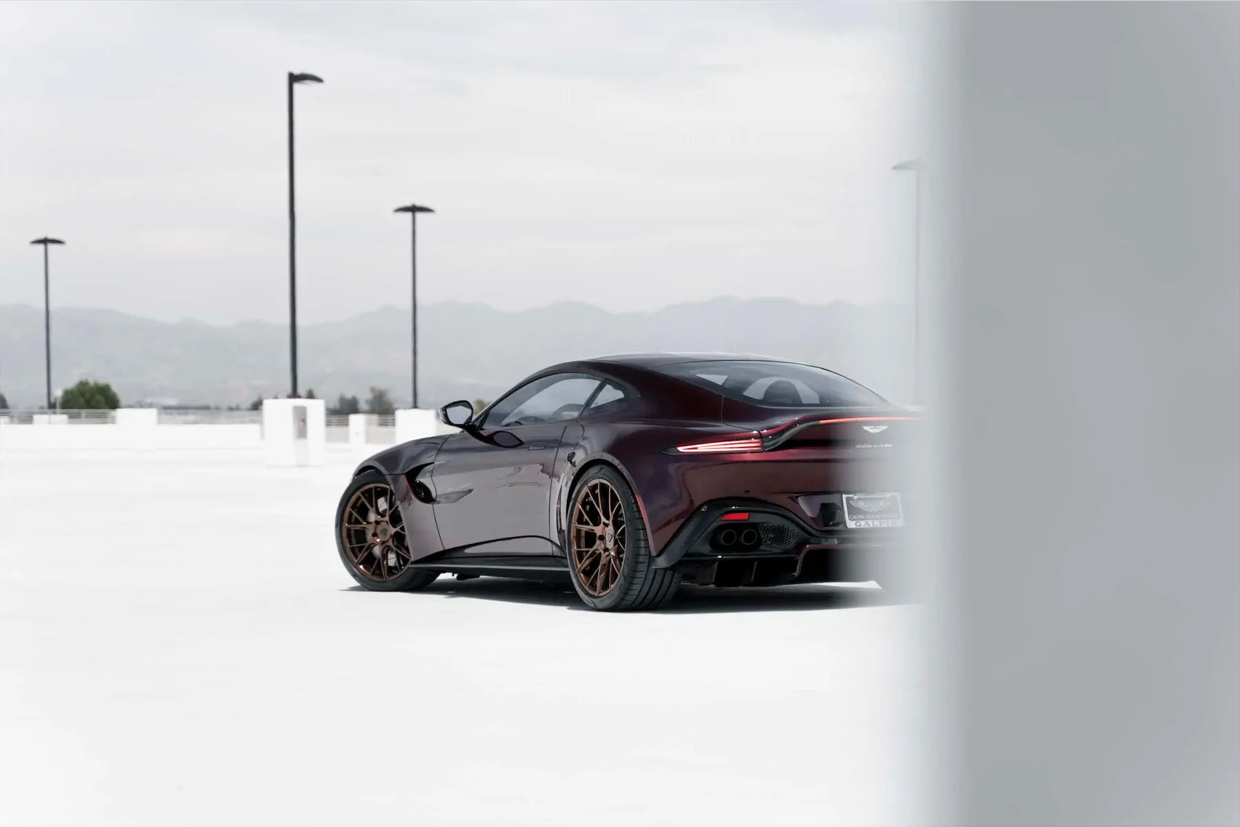 A 2020 Aston Martin Vantage on Blaque Diamond BD-F18 Liquid Polished Bronze Wheels