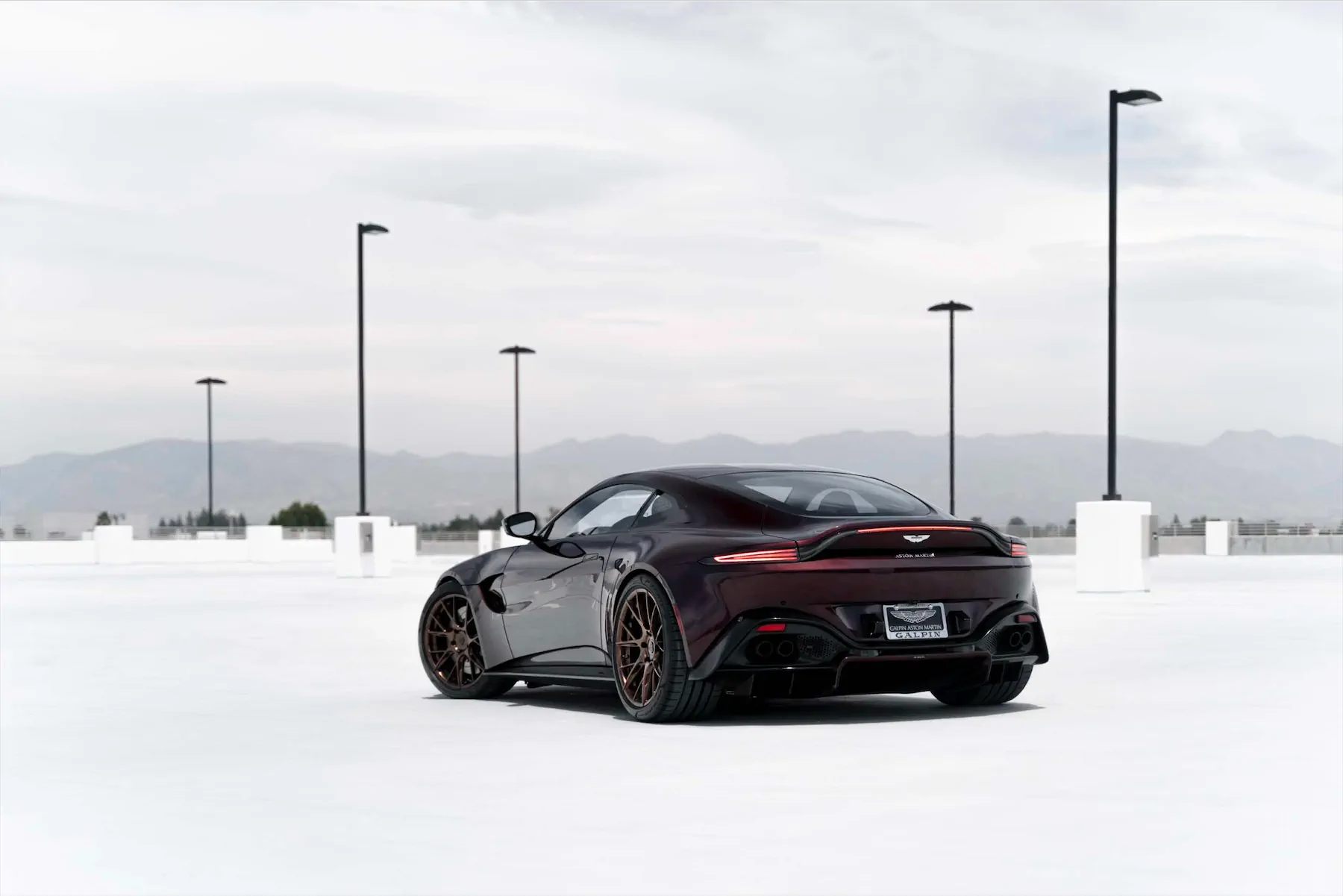A 2020 Aston Martin Vantage on Blaque Diamond BD-F18 Liquid Polished Bronze Wheels